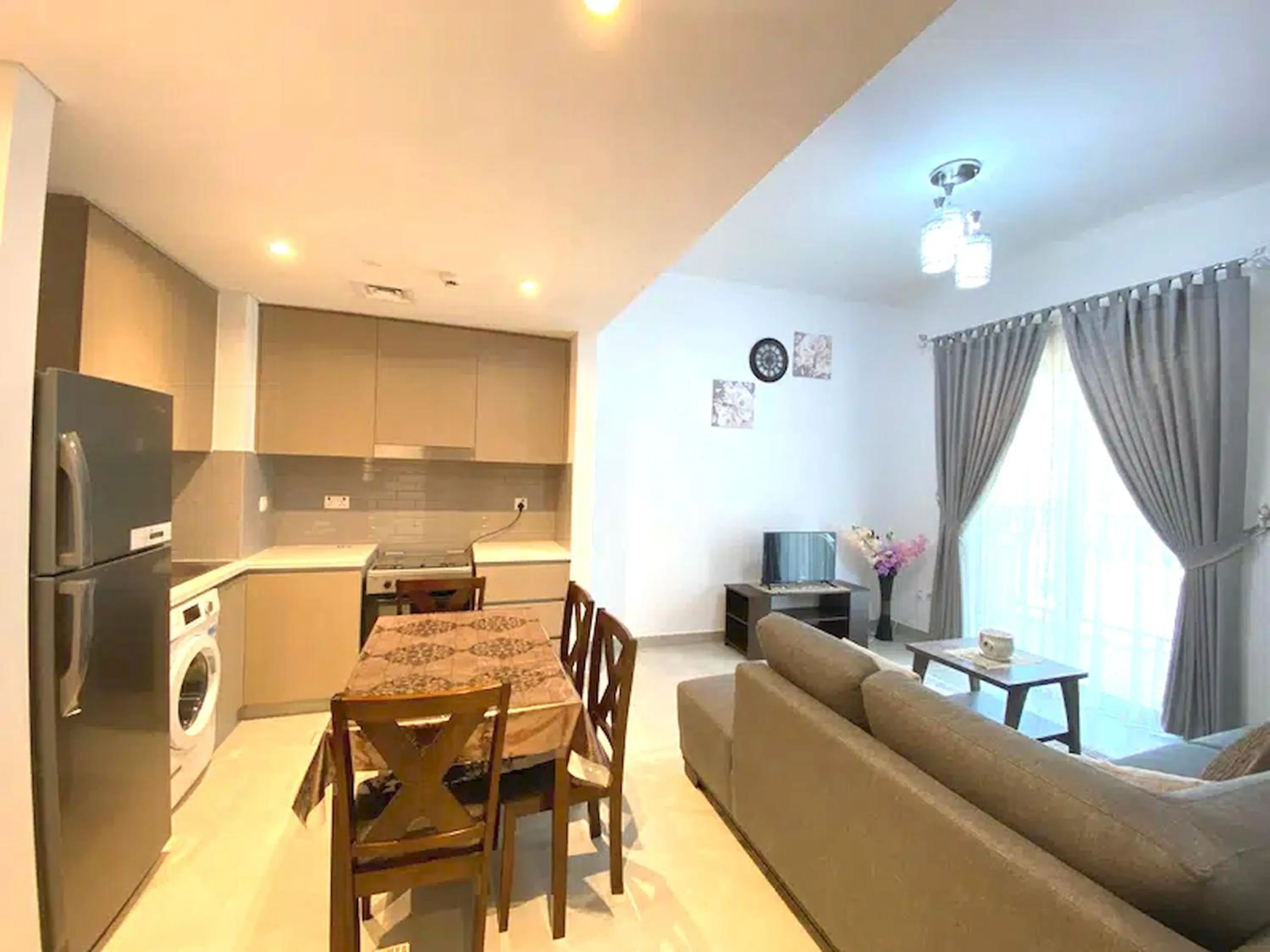 TV and multimedia, Seating Area in Super OYO 928 Home 436 Binghatti Mirage - 1Br, Jvc