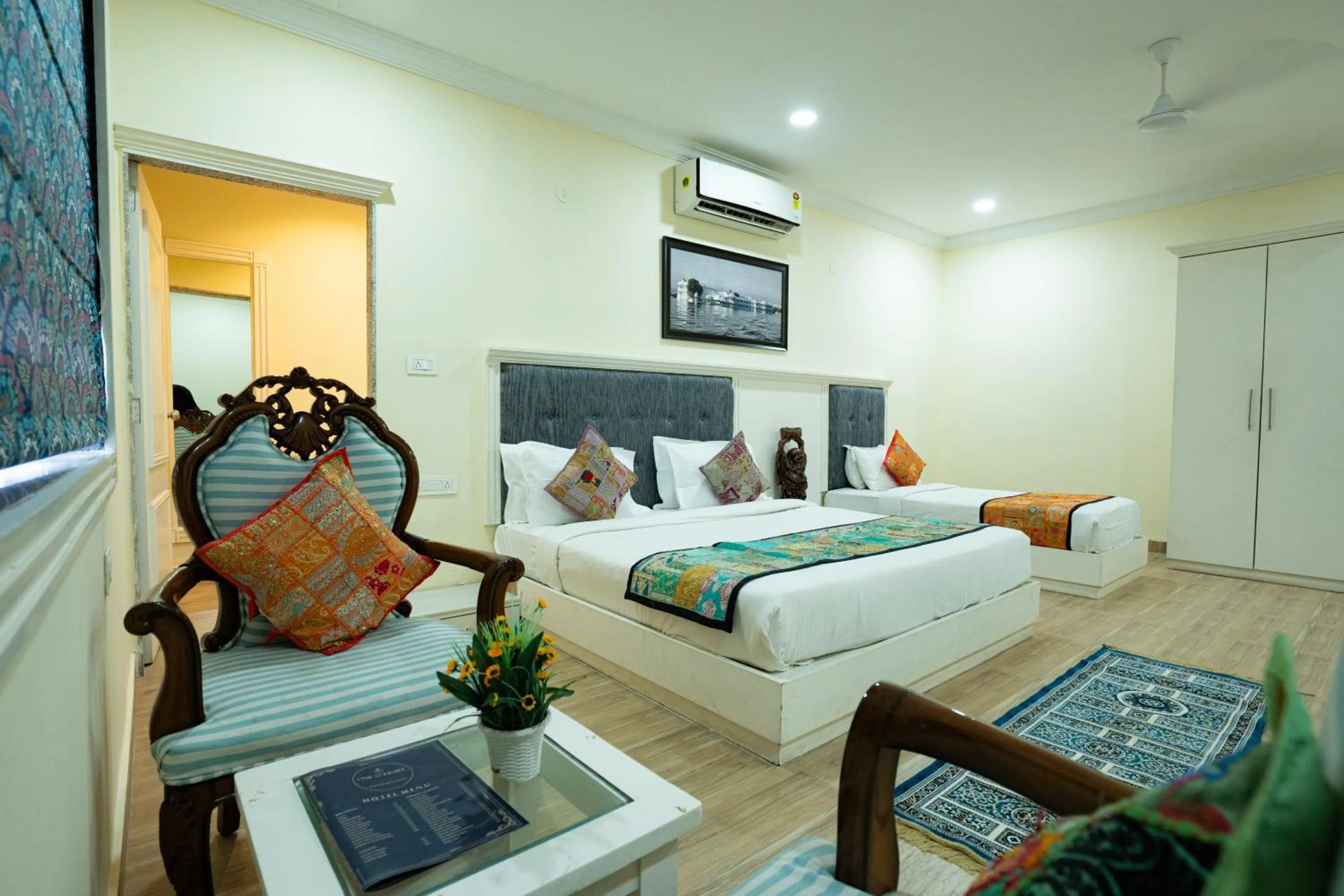 Bed in Tripli Hotels White Manor