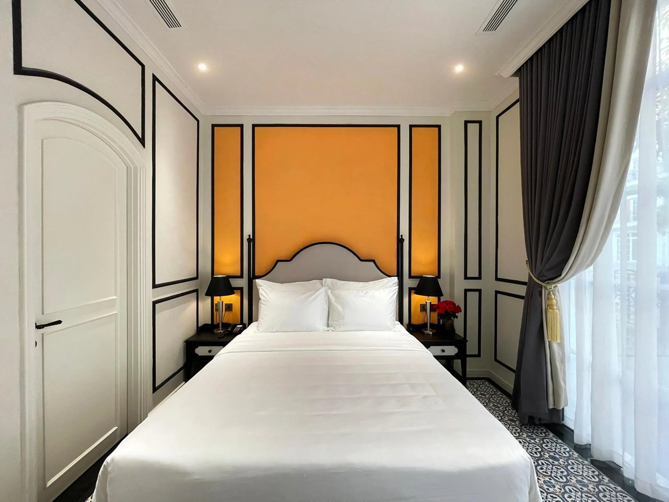 Bed in Le Bonheur Hotel