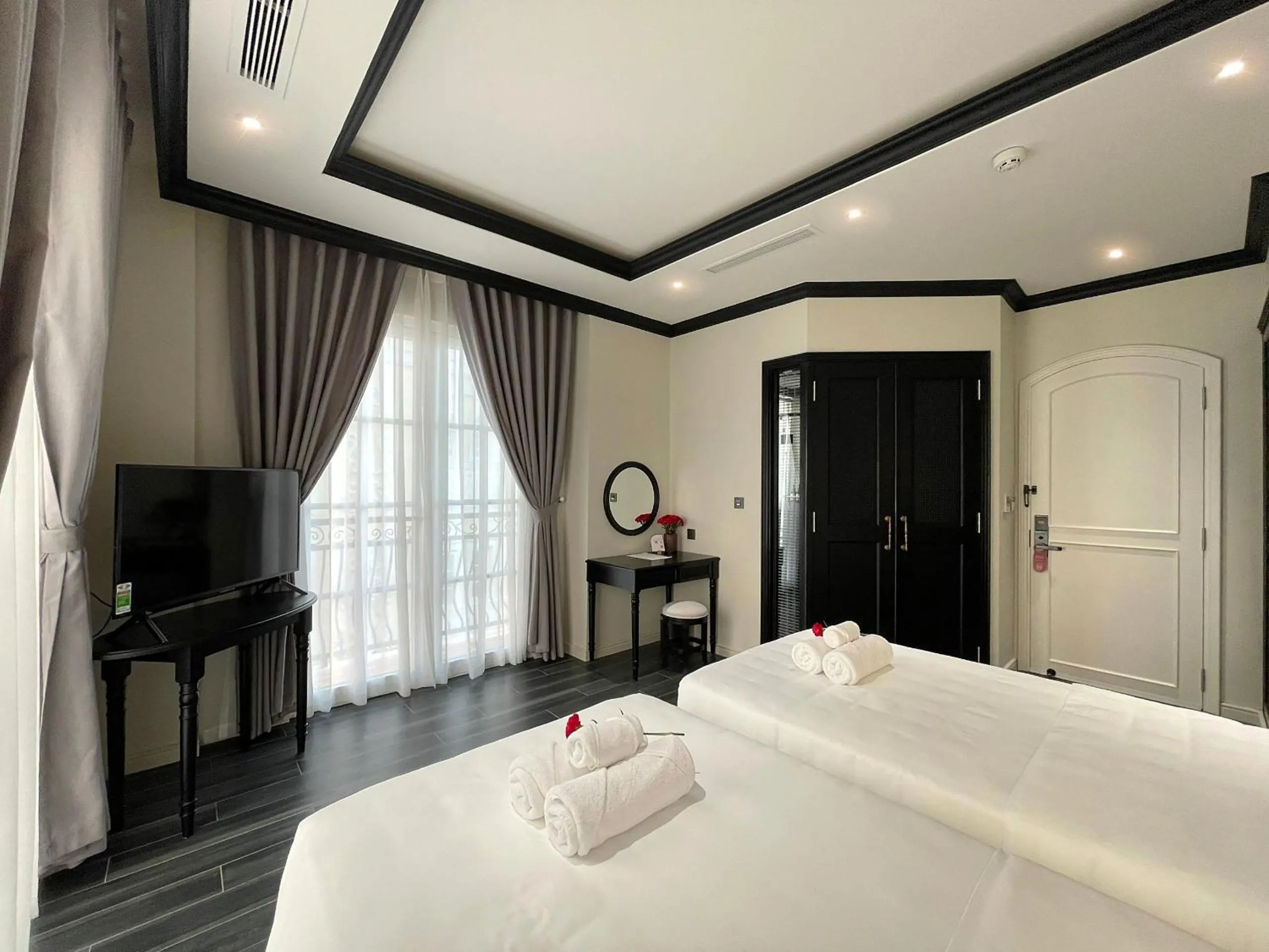 Bed in Le Bonheur Hotel