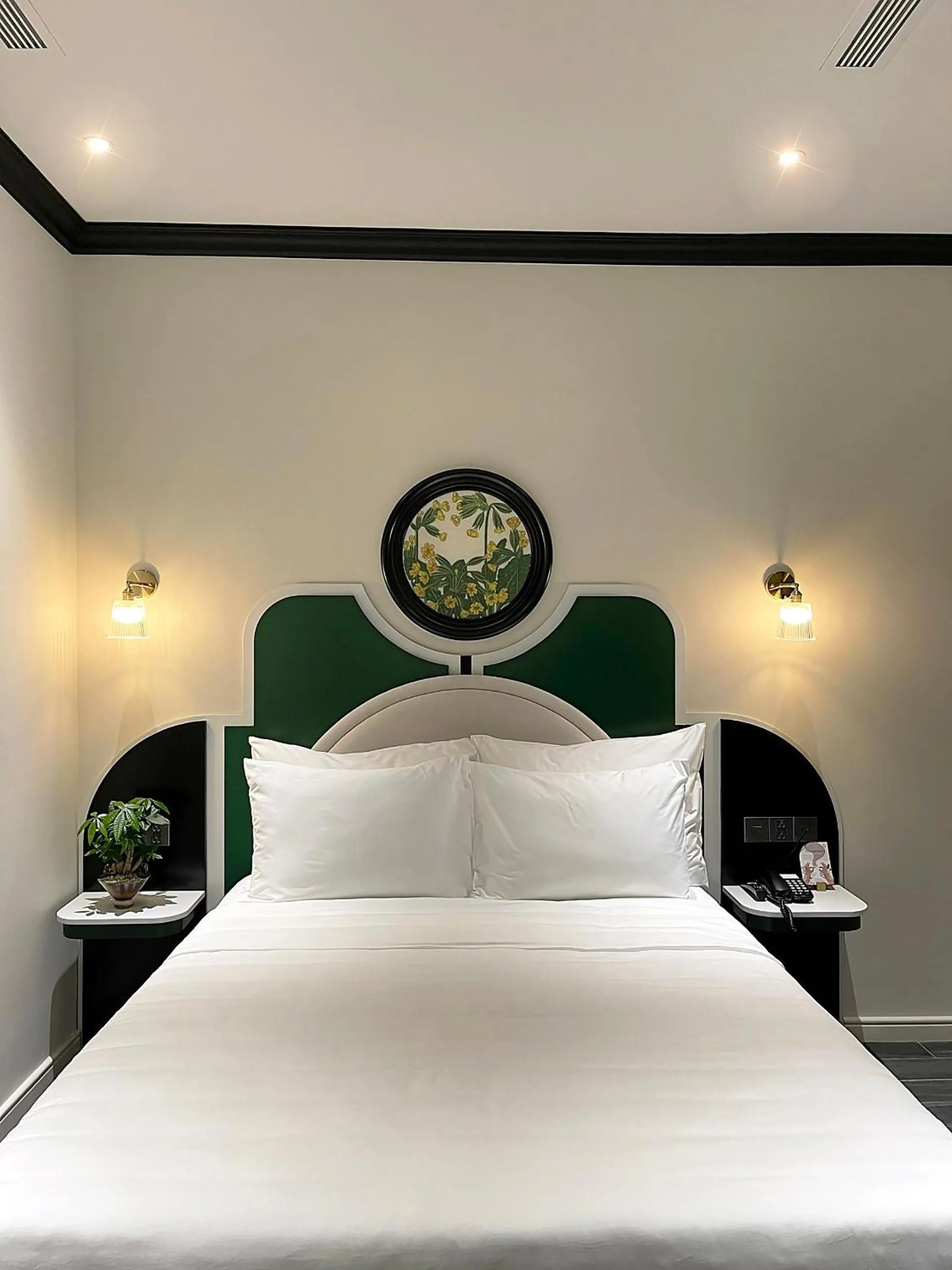 Bed in Le Bonheur Hotel