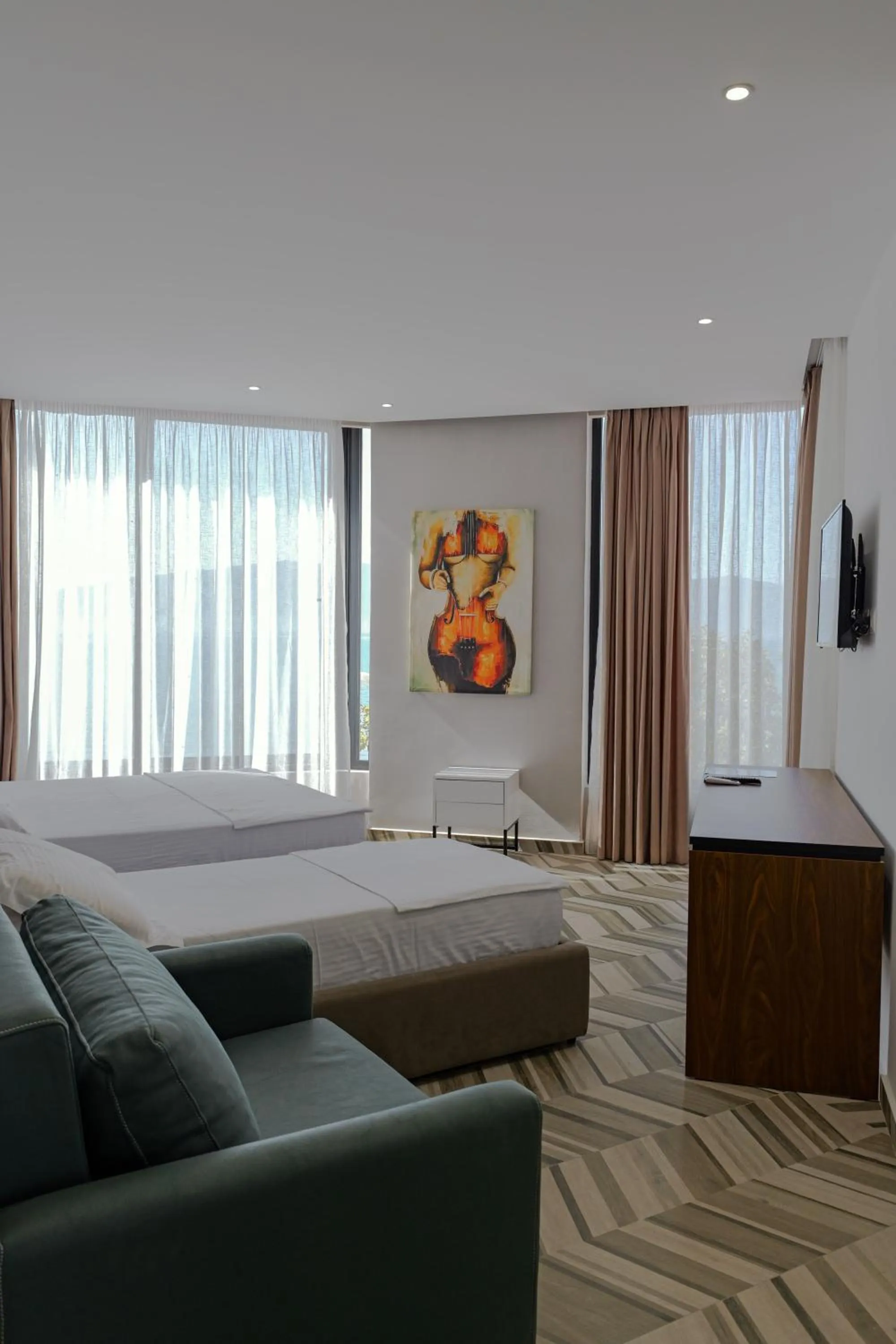 Communal lounge/ TV room, Bed in Sea & Sand Hotel