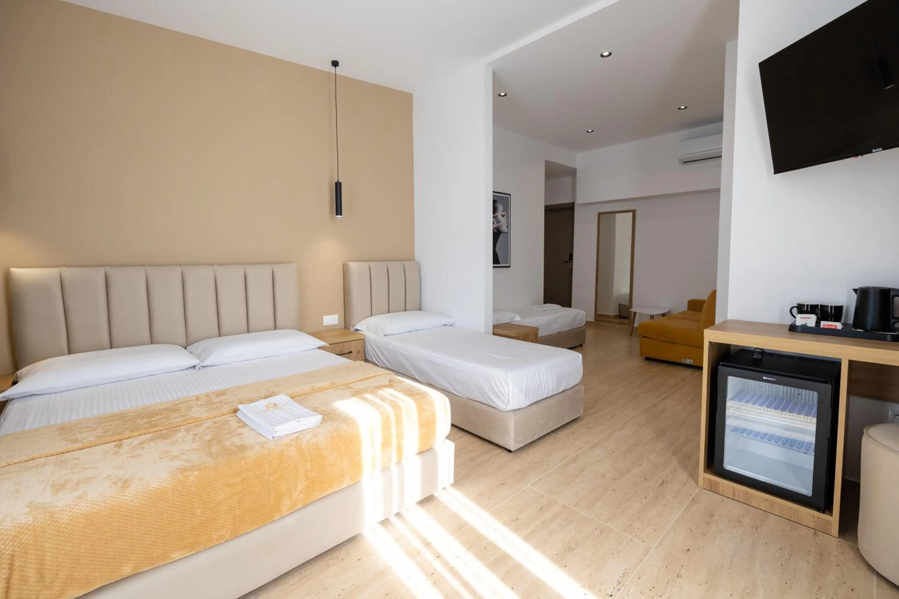 Communal lounge/ TV room, Bed in Sea & Sand Hotel