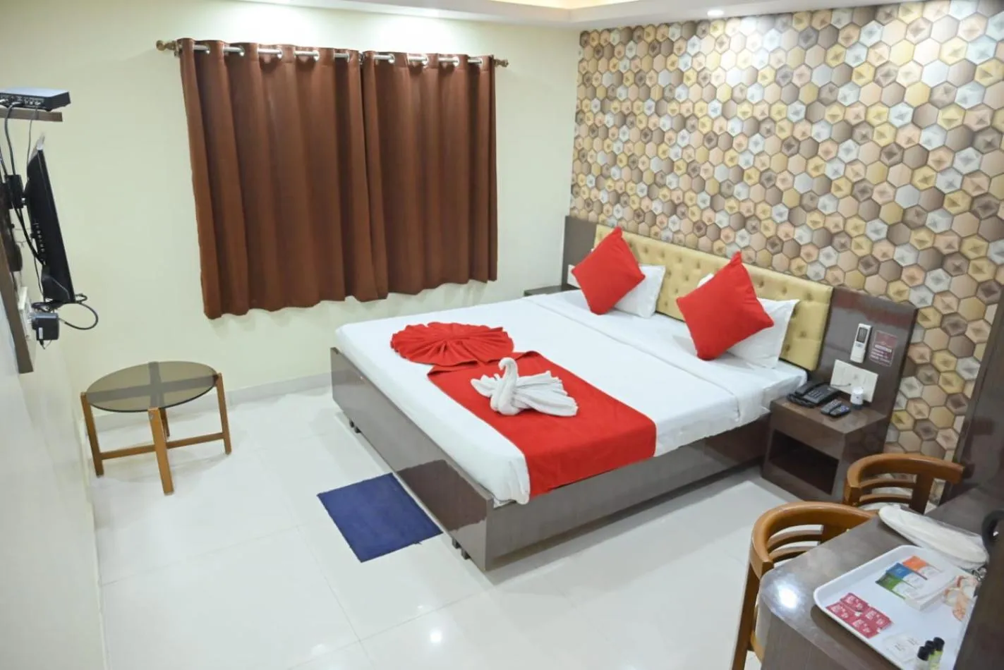 Bed in Hotel Jyoti International