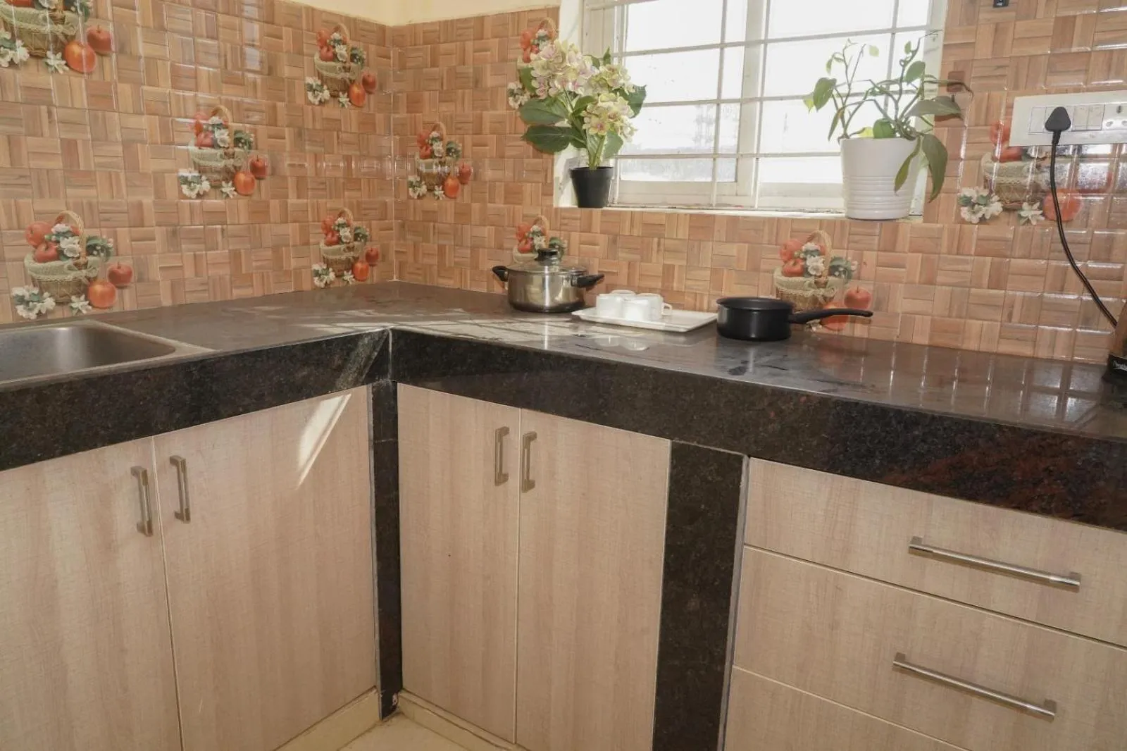 Kitchen or kitchenette in HOTEL ROYAL SUITES AND ROOMS Near AIG Hospital Gachibowli