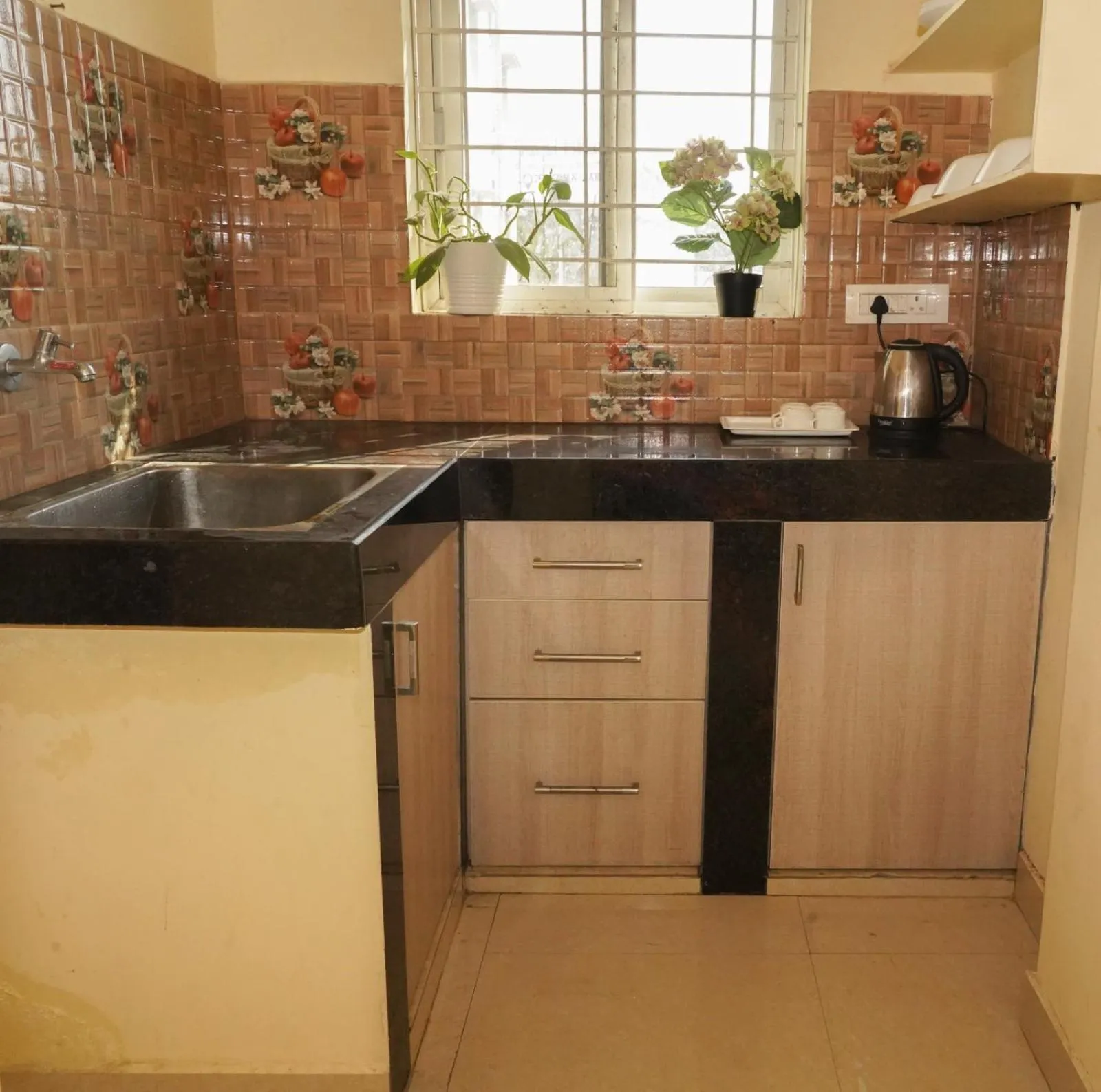 Kitchen or kitchenette in HOTEL ROYAL SUITES AND ROOMS Near AIG Hospital Gachibowli