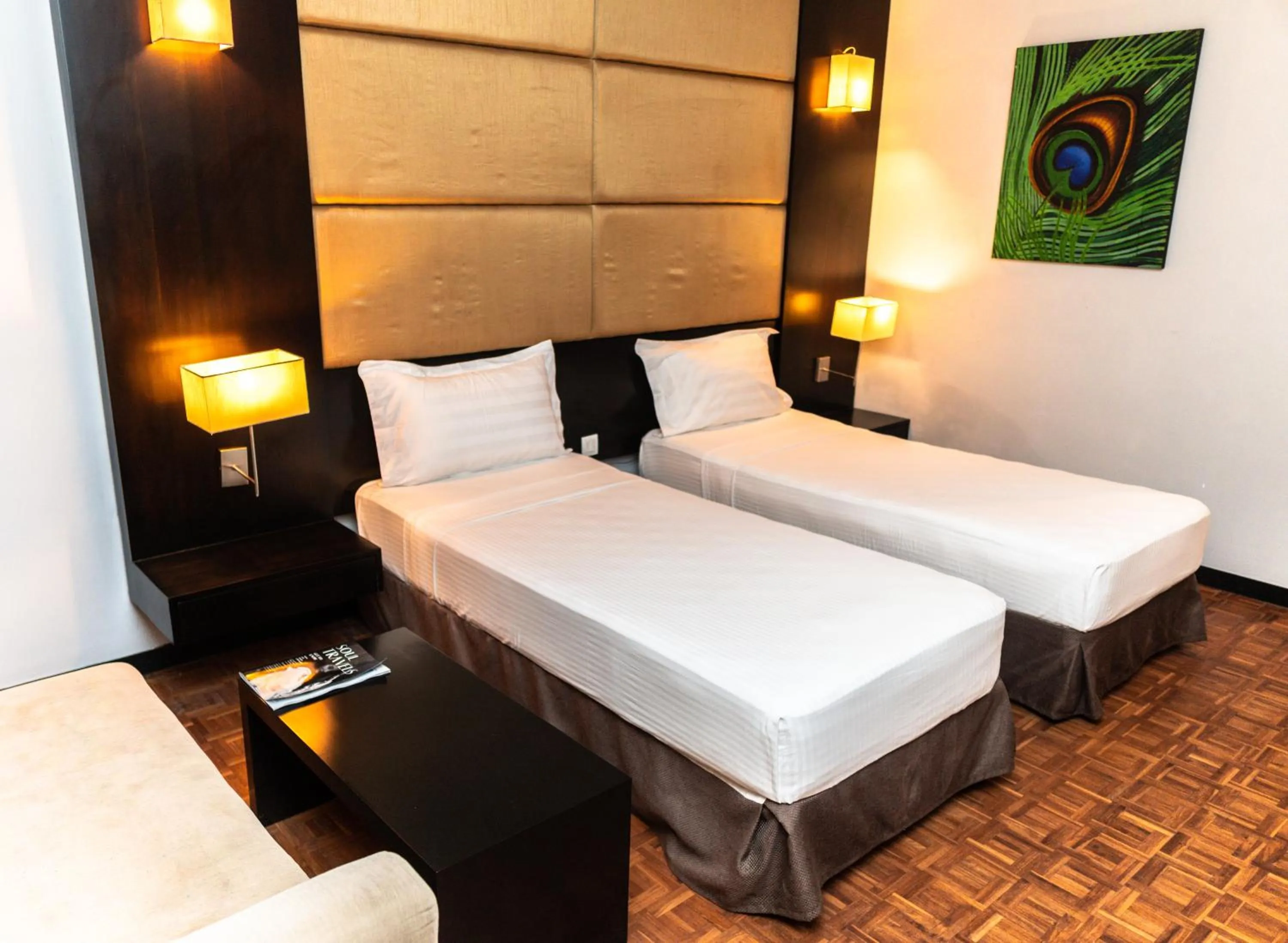 Bed in Peacock Beach Resort and Spa