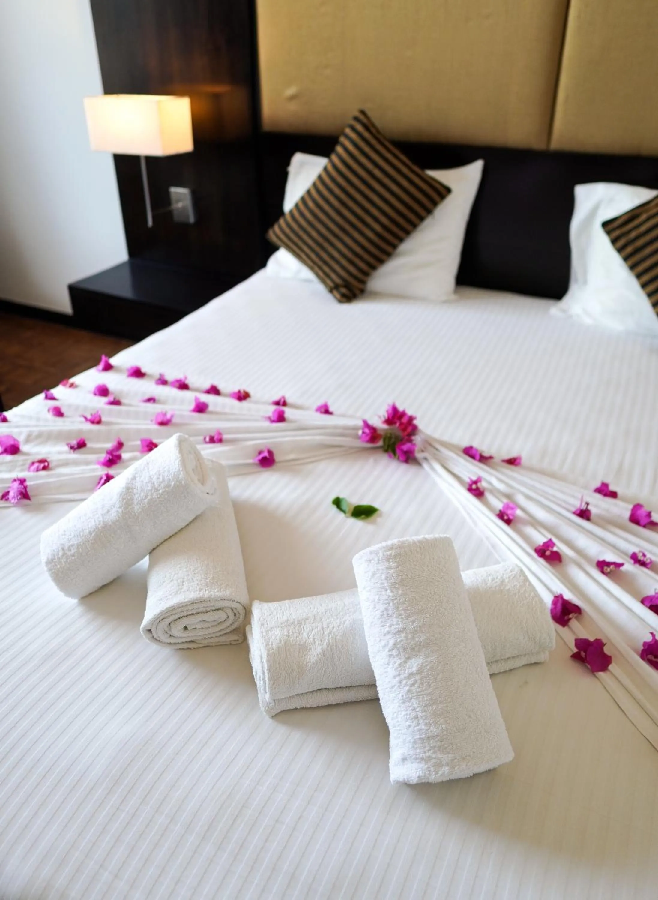 Bed in Peacock Beach Resort and Spa