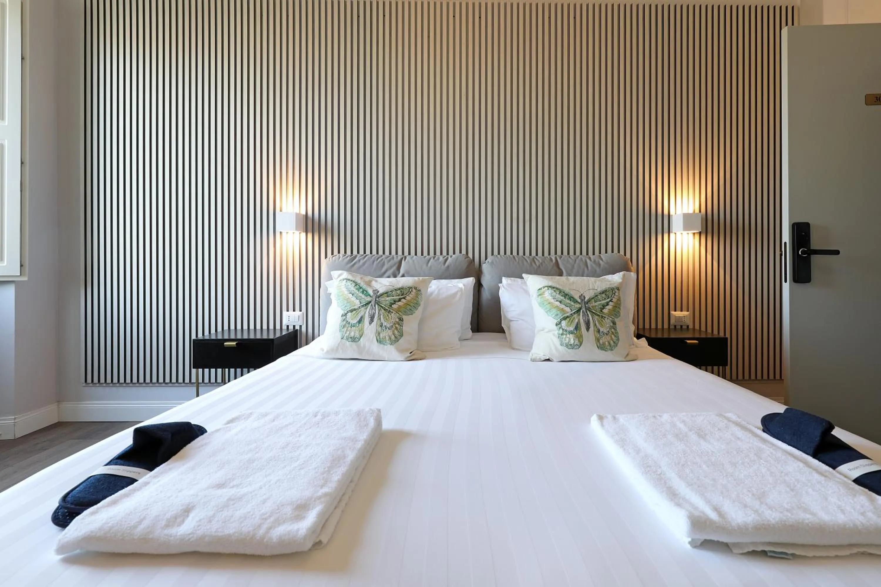 Bed in Rome Plaza Suites, Luxury Collection