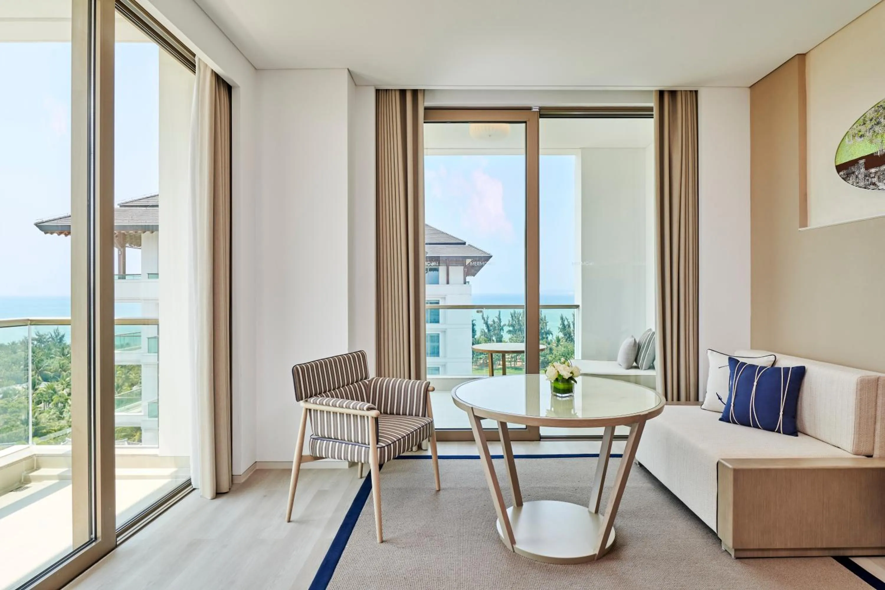 Seating area in The Mermoon Resort Hainan Tufu Bay, Tapestry By Hilton