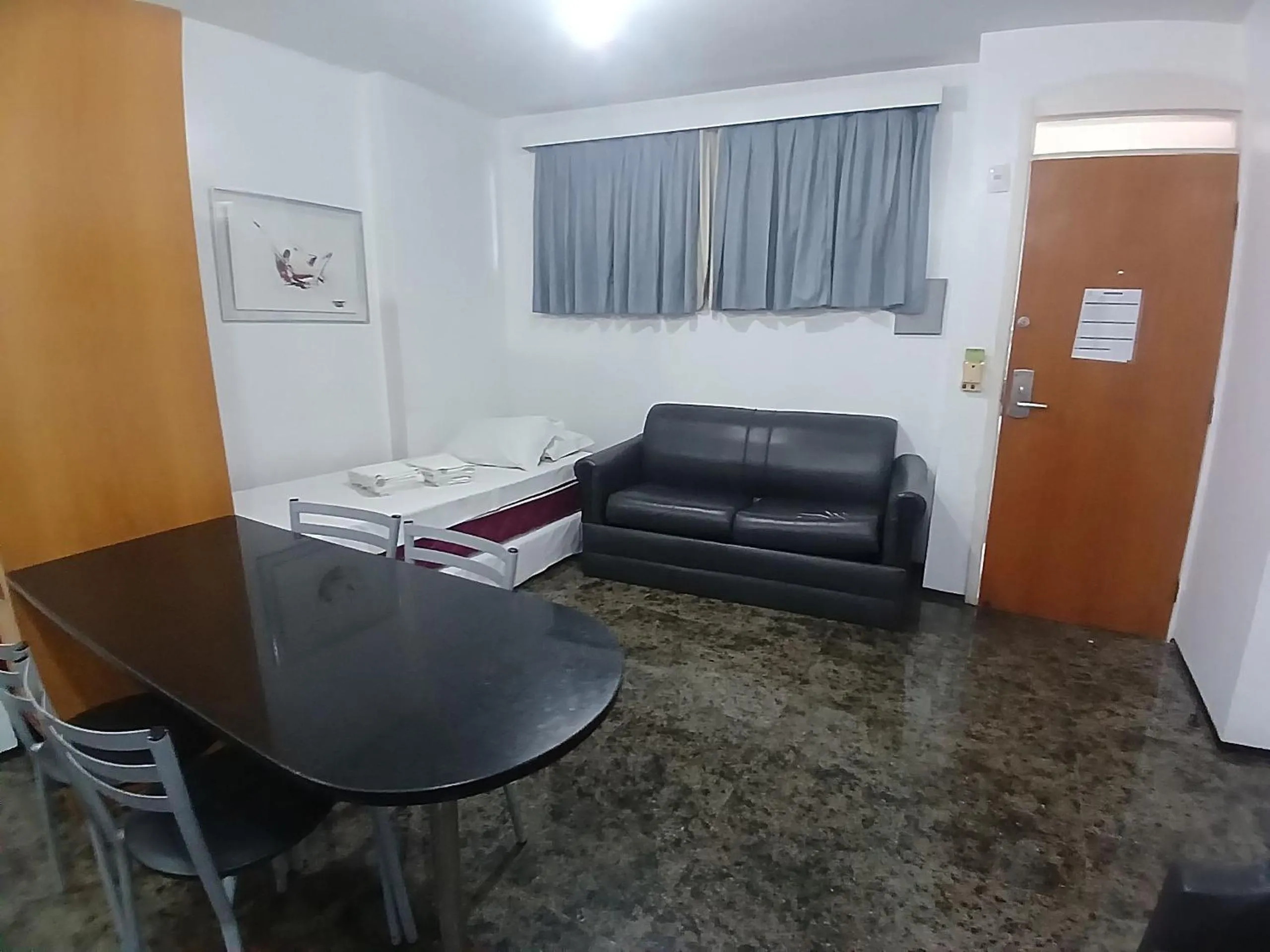 Living room in Flat Brasil Tropical Meireles by Escala