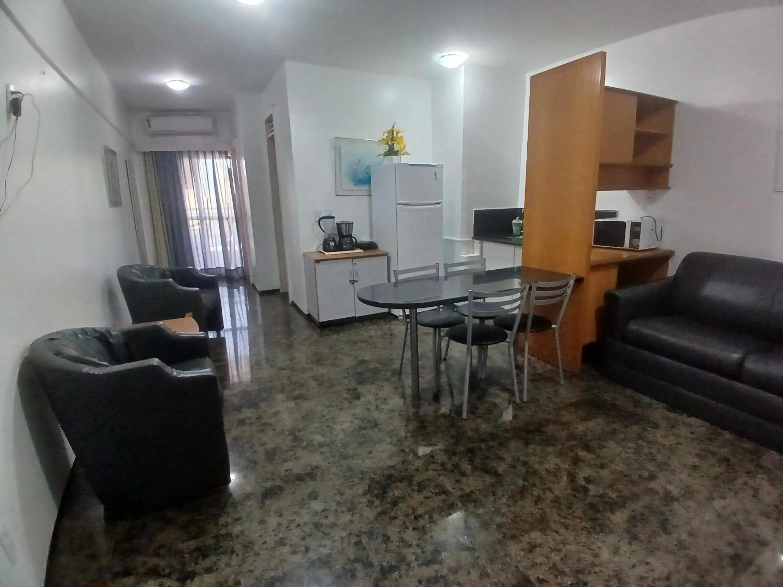 Living room in Flat Brasil Tropical Meireles by Escala