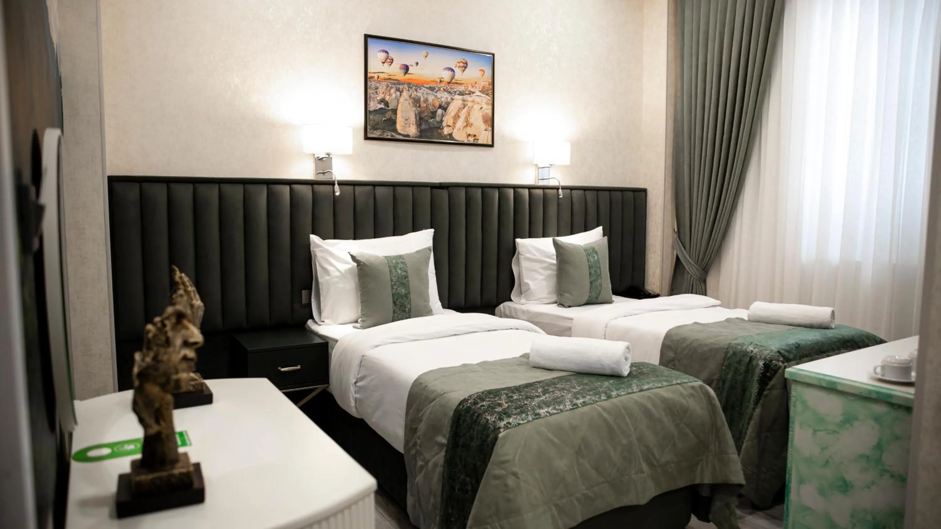 Bed in Essam Deluxe Hotel