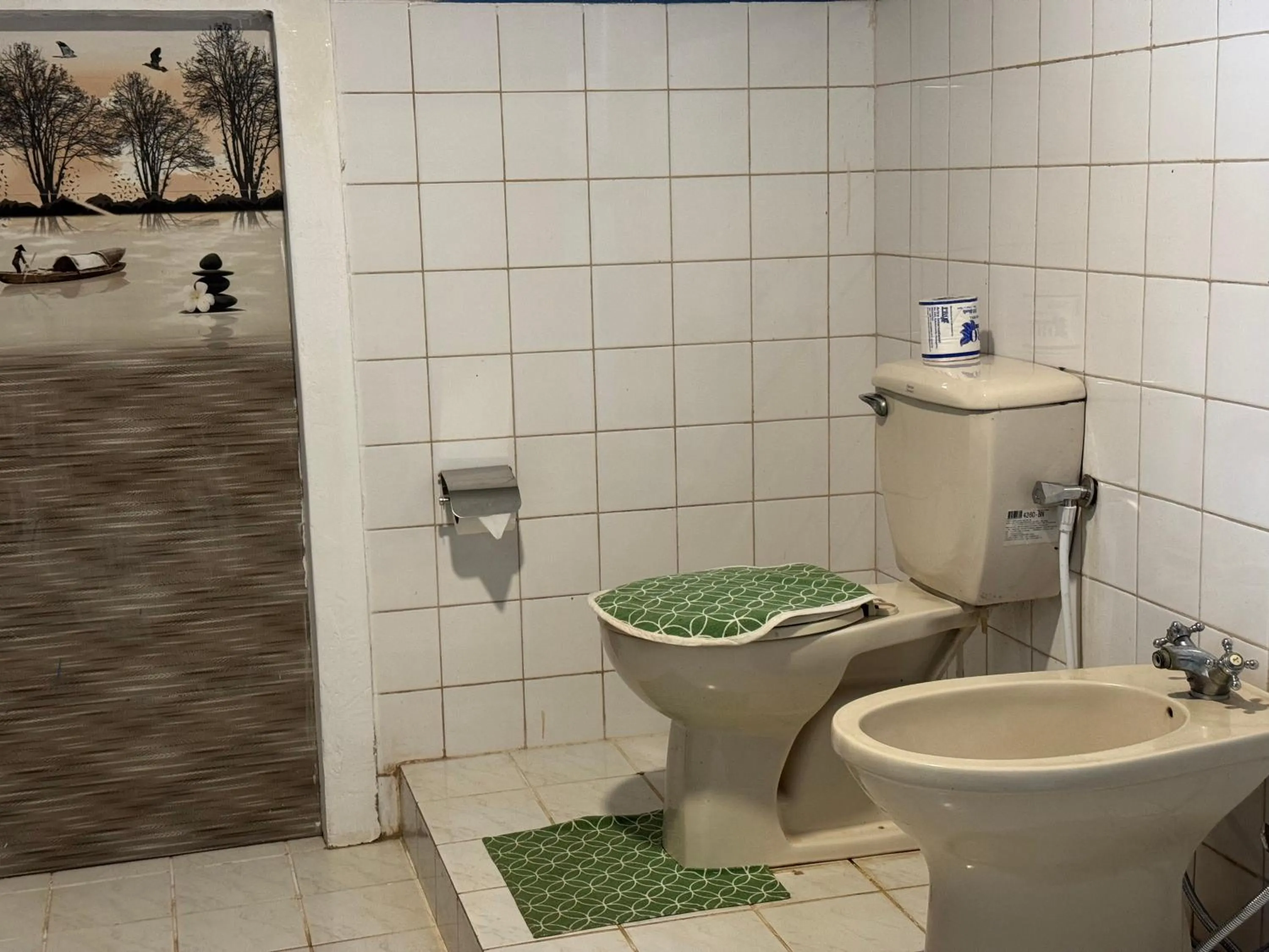 Toilet in Steps Garden Resort