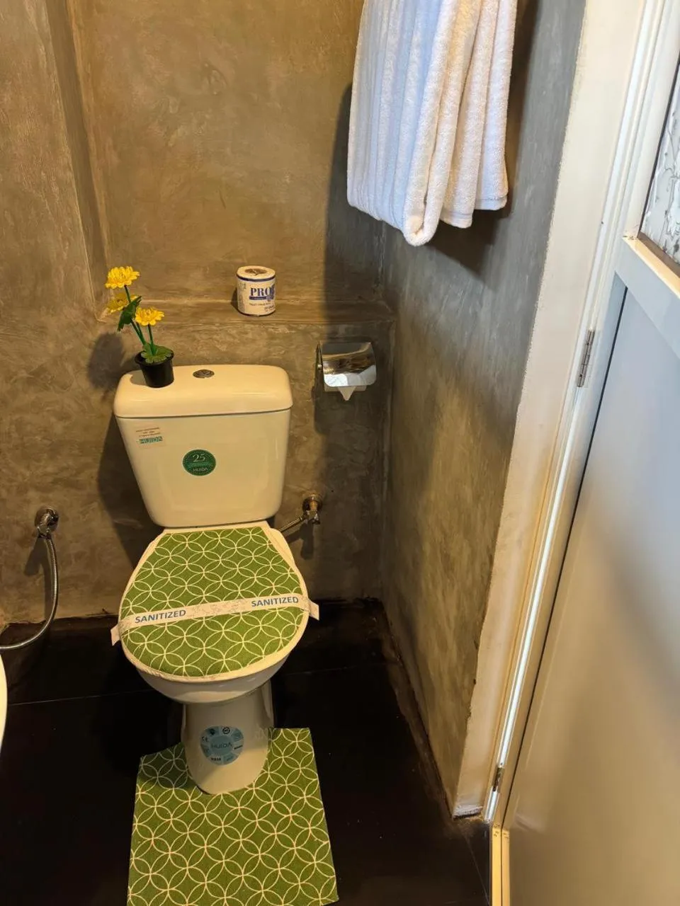 Toilet in Steps Garden Resort