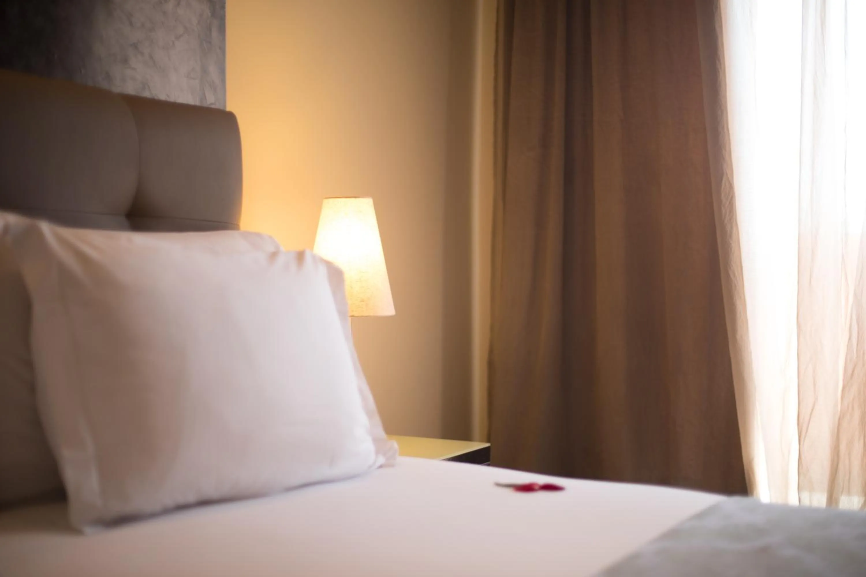 Bed in Dellarosa Boutique Hotel and Spa