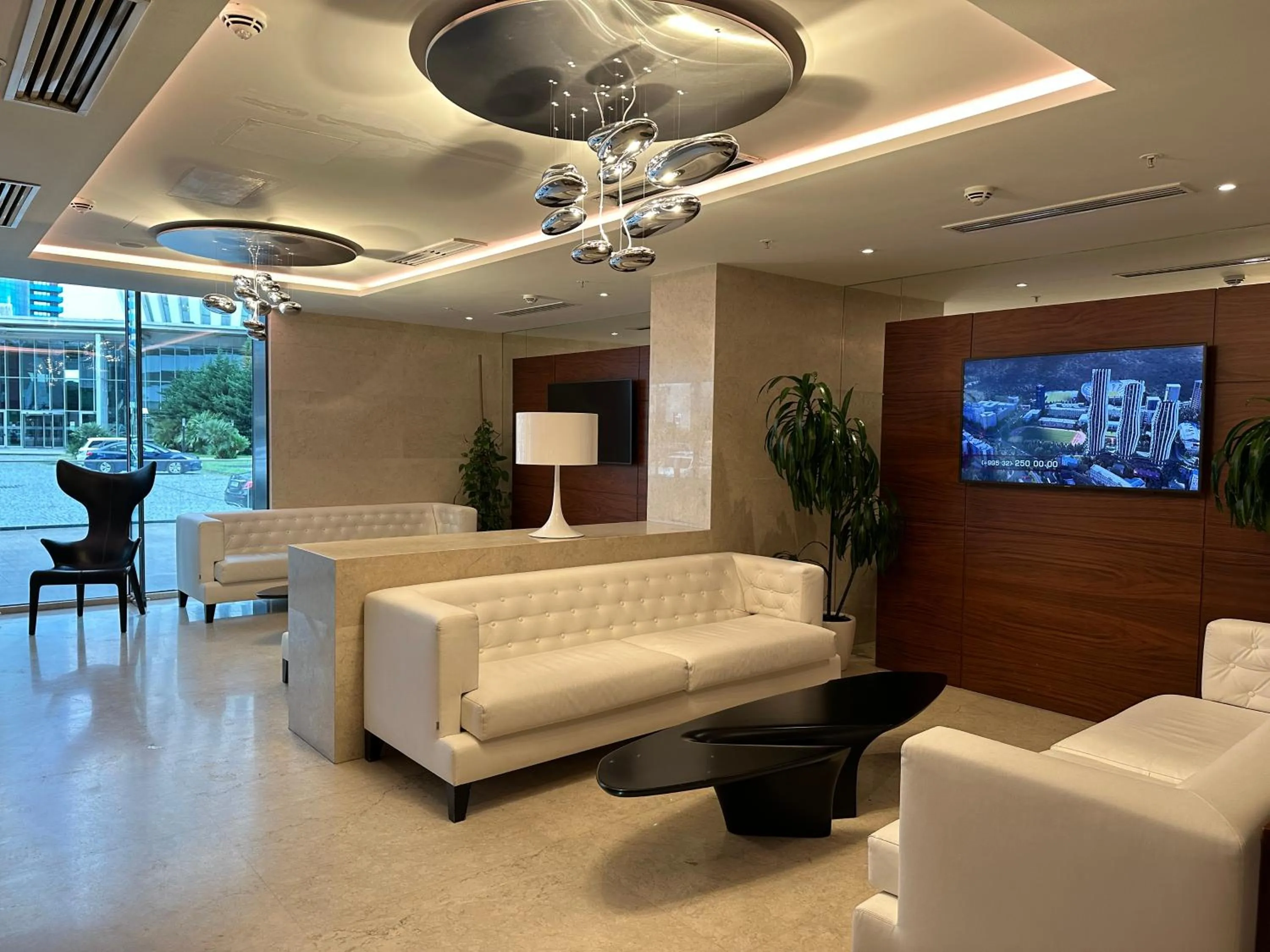 Communal lounge/ TV room in Dream Apartments at Alliance Palace