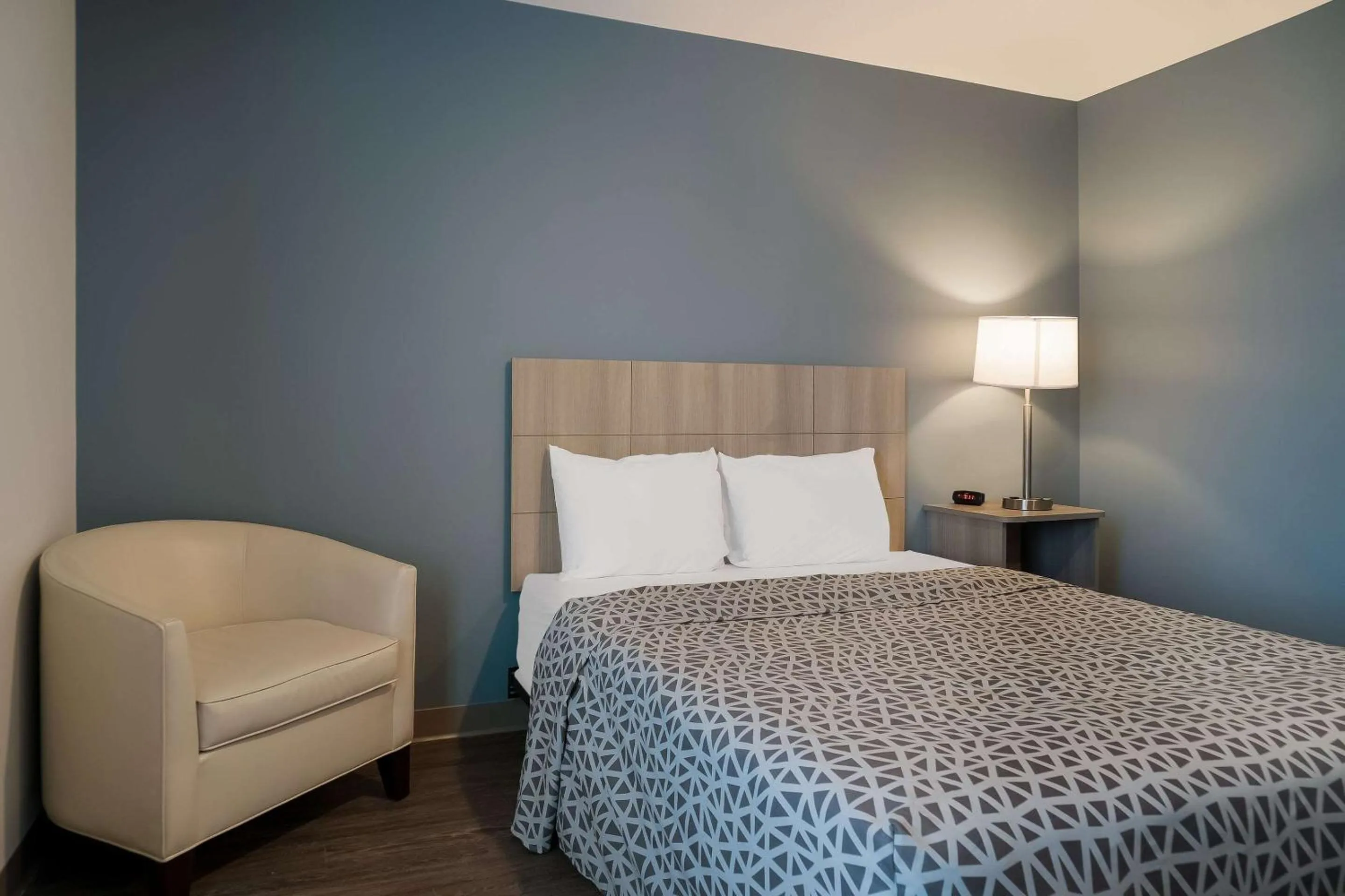 Bedroom, Bed in WoodSpring Suites Detroit Sterling Heights