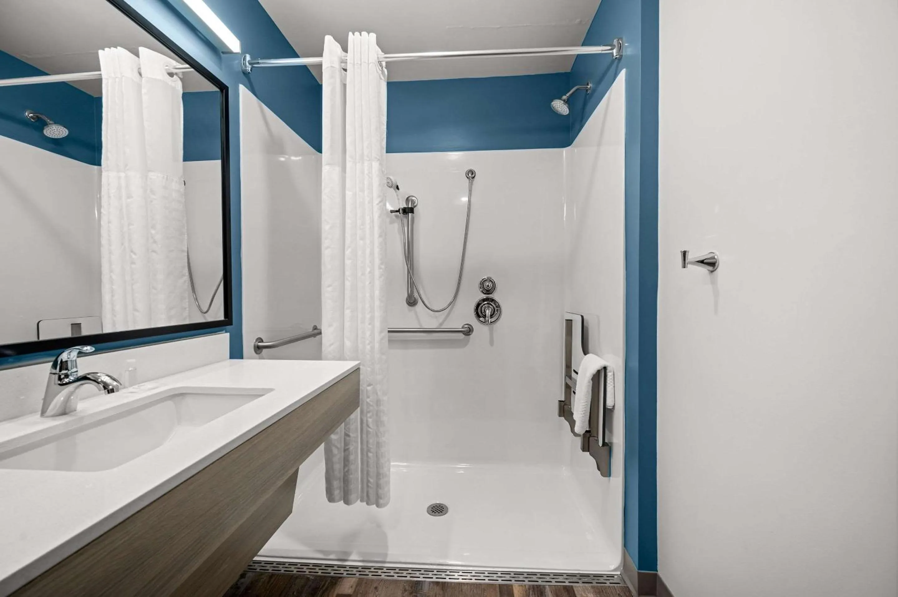 Bathroom in WoodSpring Suites Dearborn Detroit