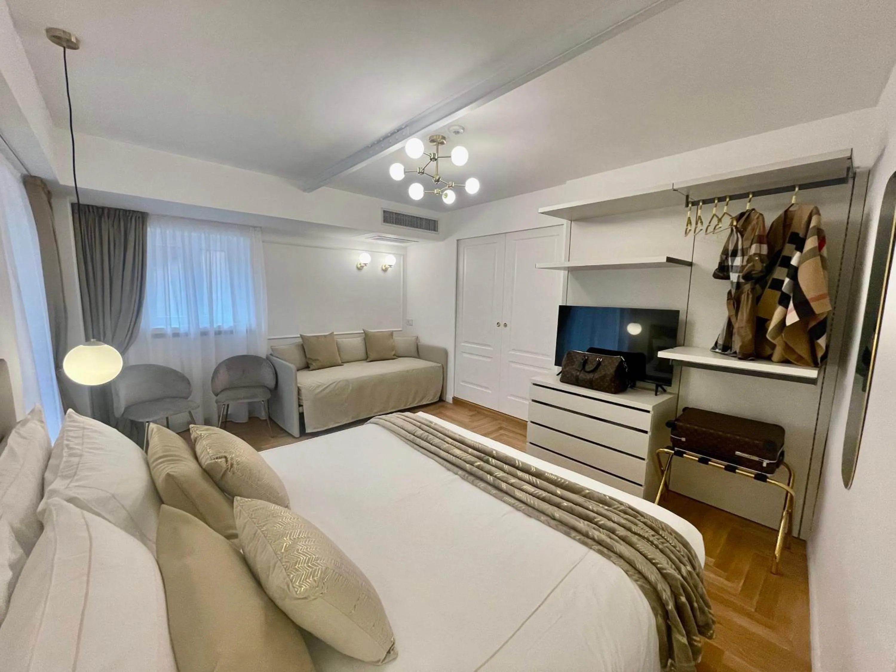 Bed in Bellagio Luxury Suites Apartments