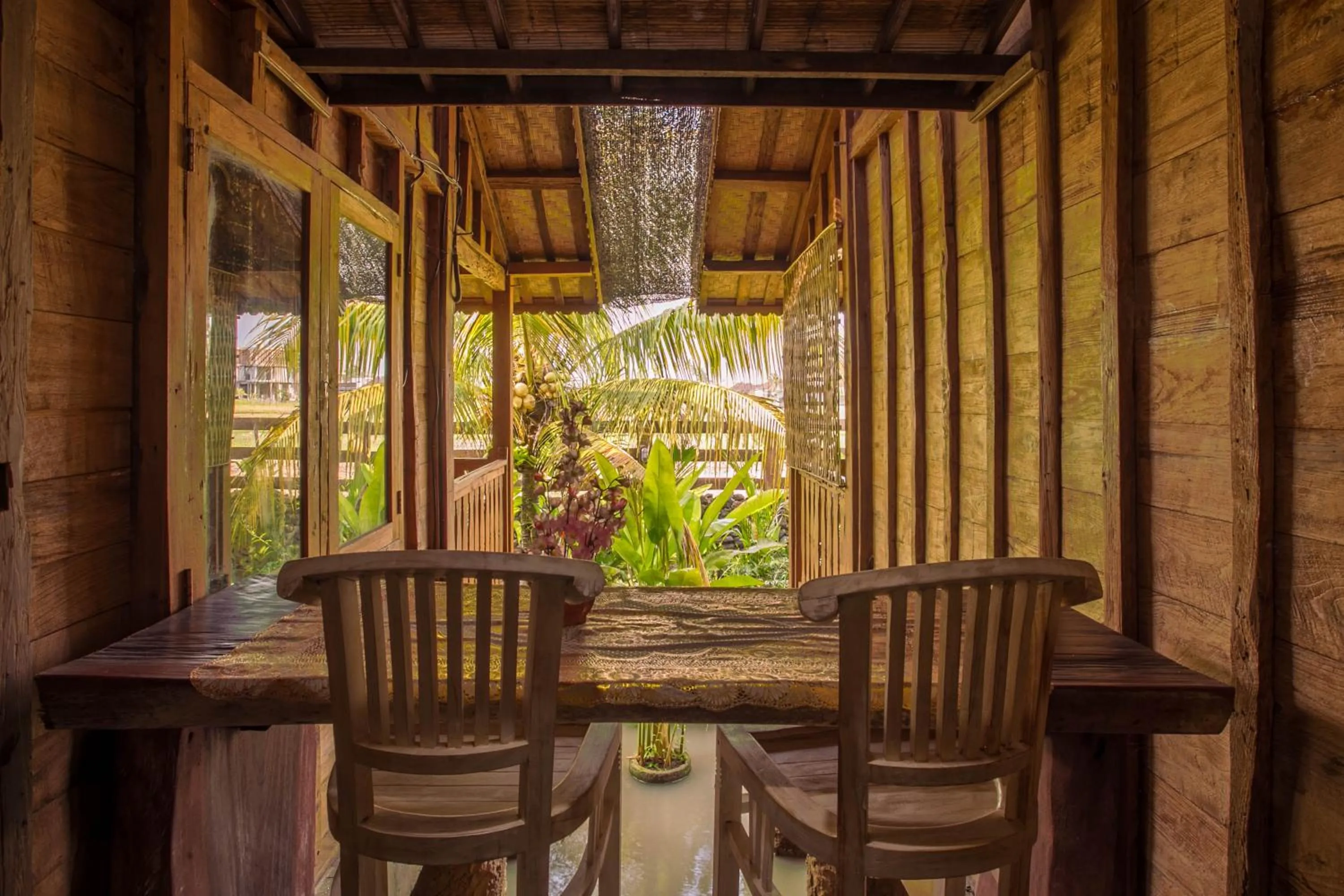 Seating area in Pondok Cap Oleng Guesthouse Canggu by Ecommerceloka