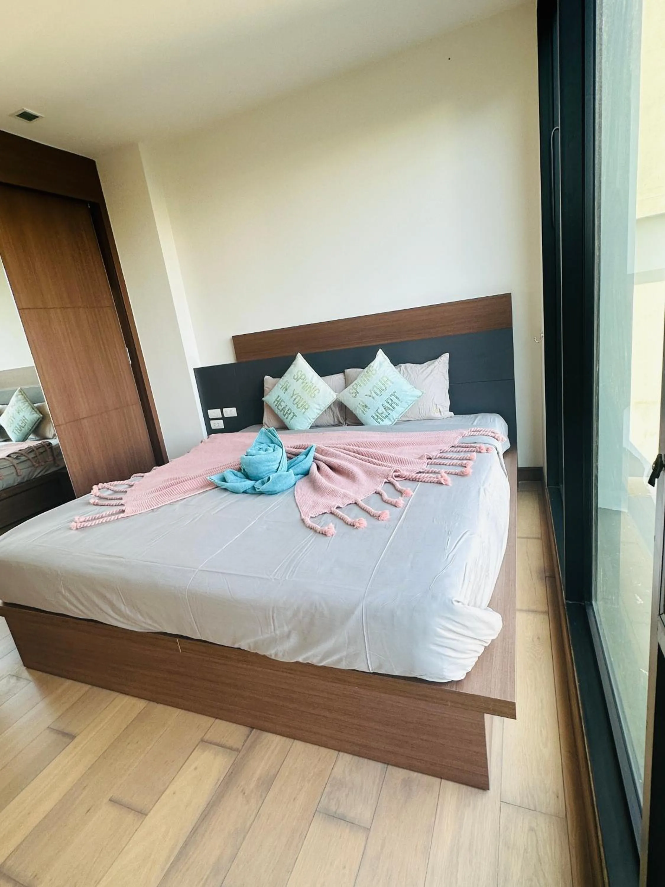 Bed in The Astra Condo Changkhlan in Chiang Mai