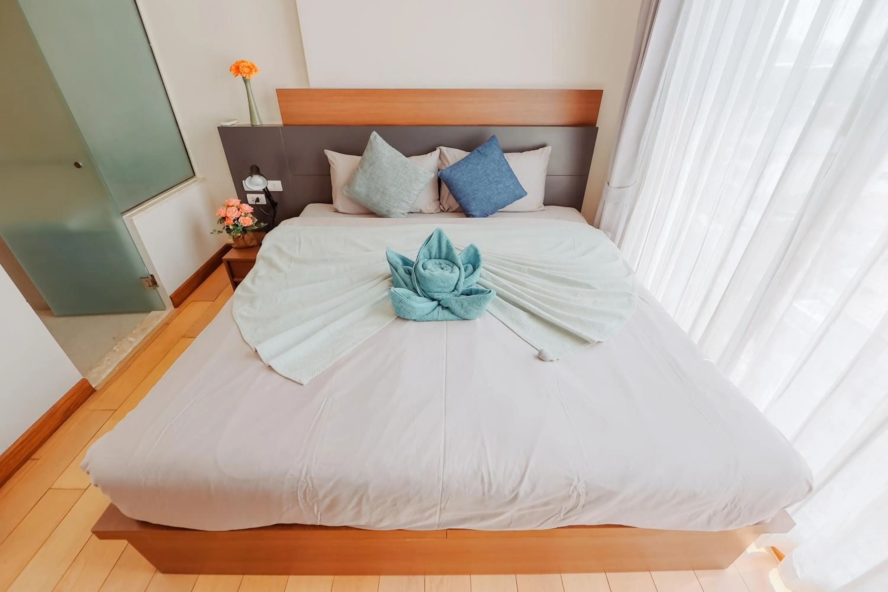 Bed in The Astra Condo Changkhlan in Chiang Mai