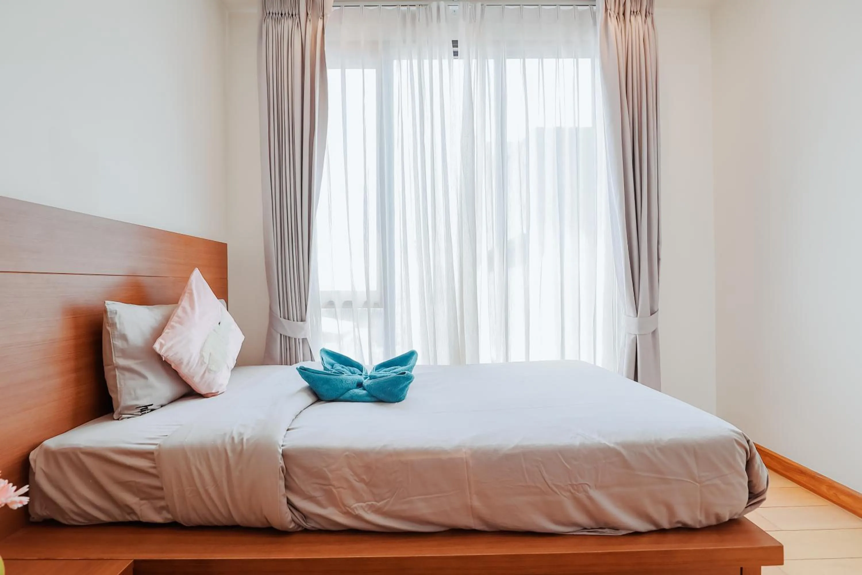 Bed in The Astra Condo Changkhlan in Chiang Mai