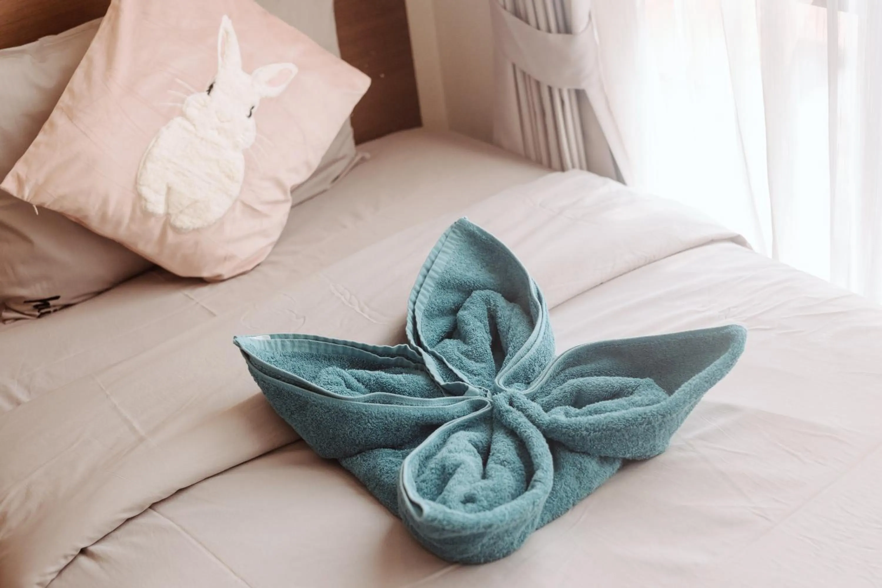 Bed in The Astra Condo Changkhlan in Chiang Mai