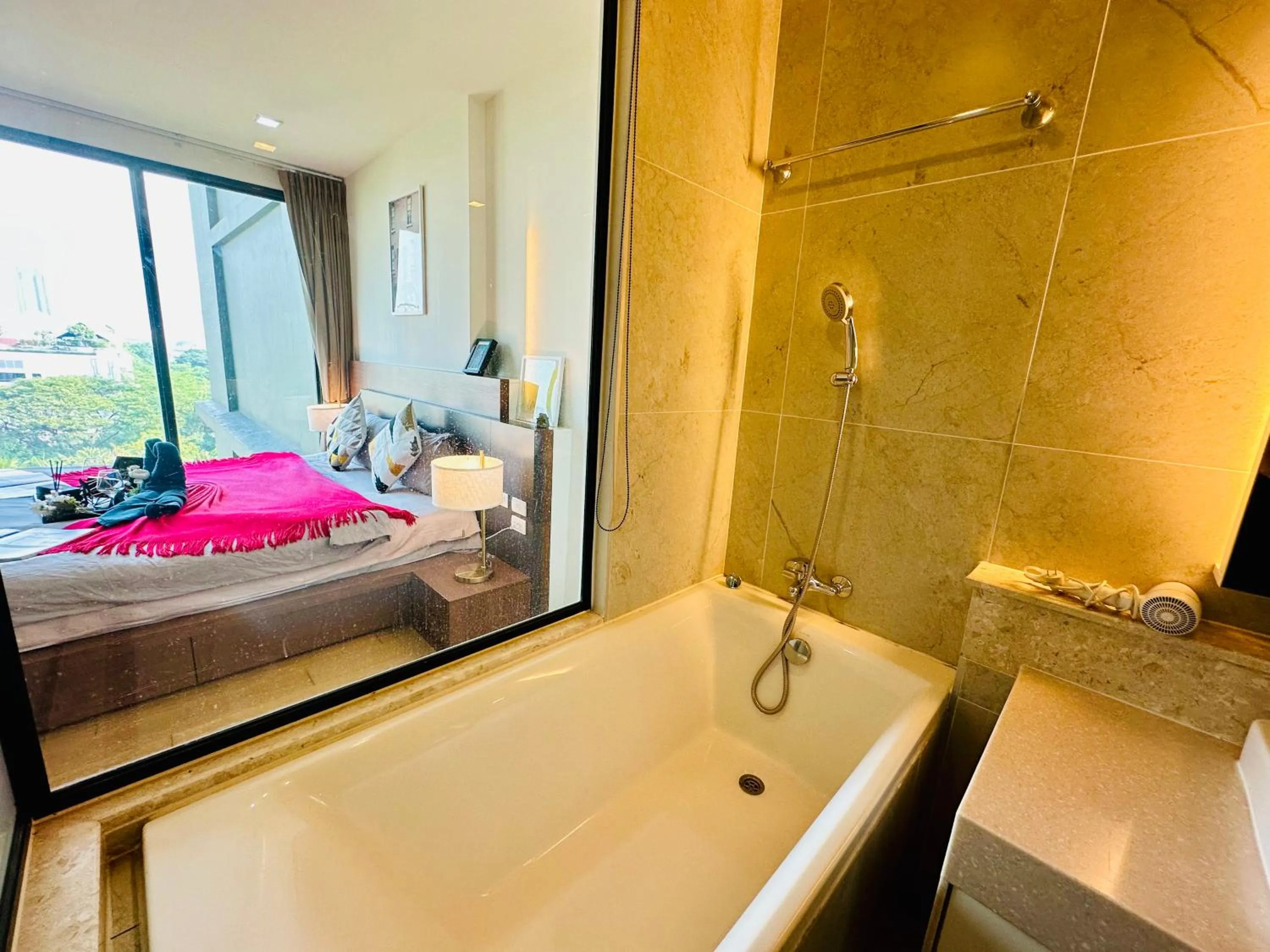 Bed in The Astra Condo Changkhlan in Chiang Mai