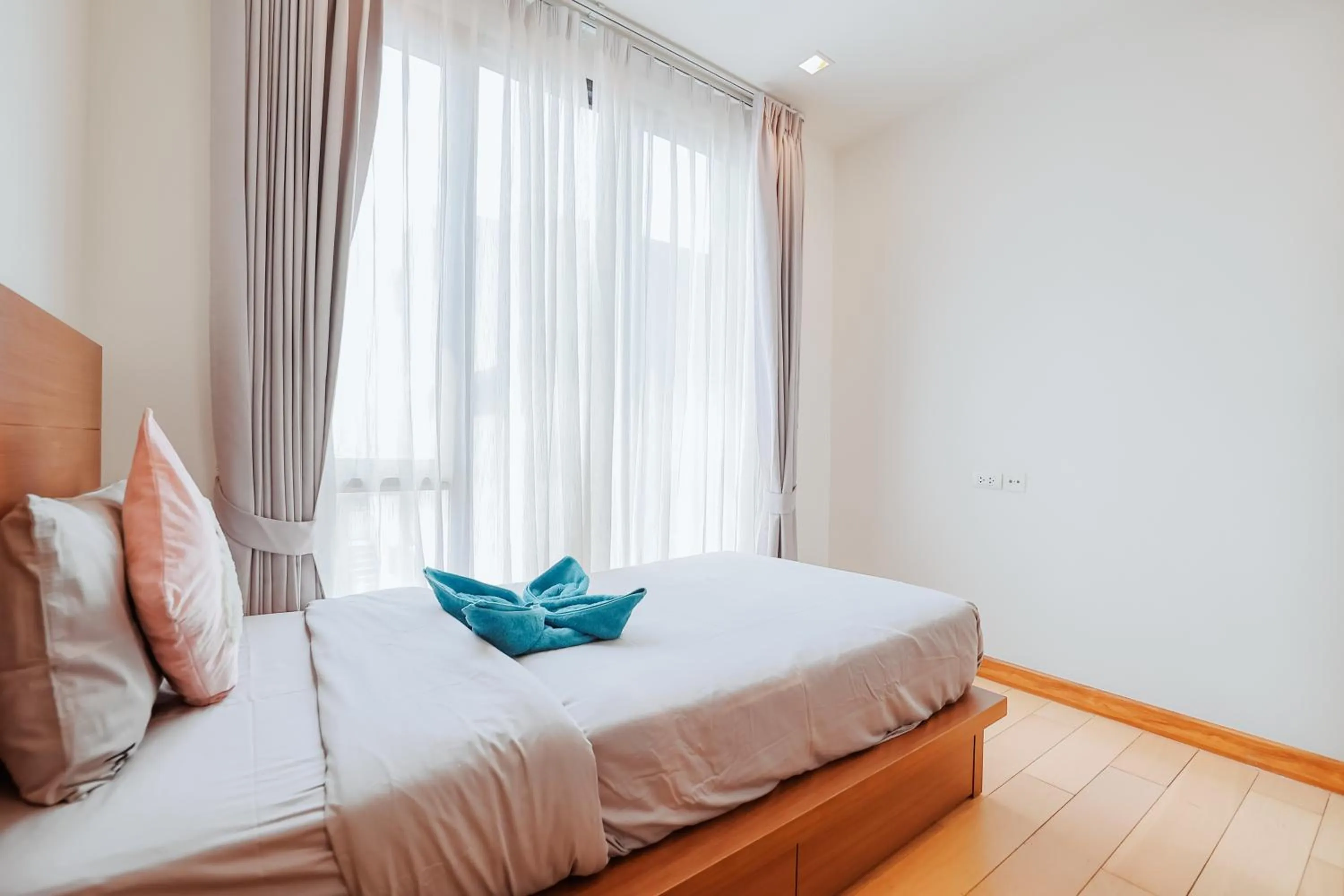 Bed in The Astra Condo Changkhlan in Chiang Mai