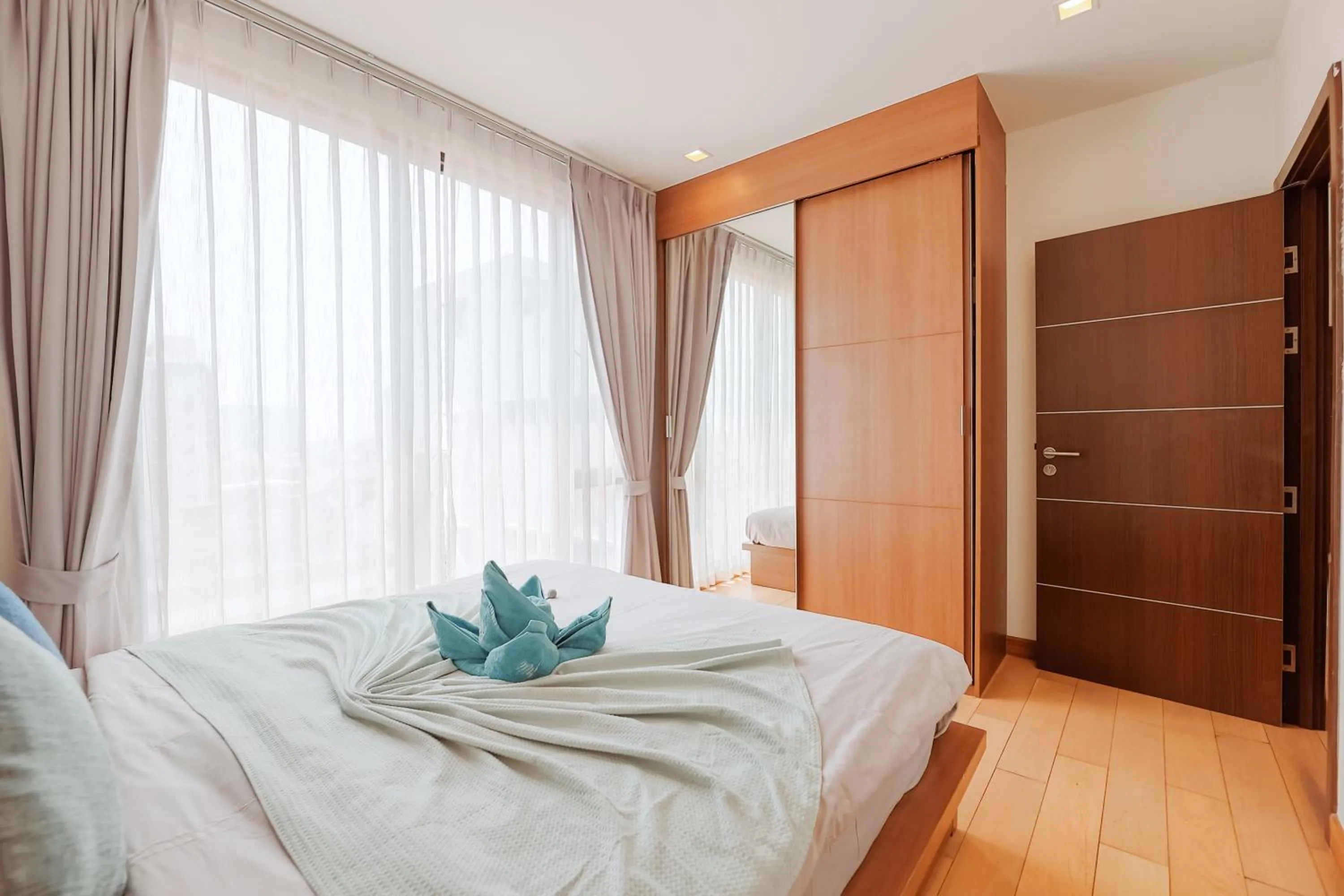 Bed in The Astra Condo Changkhlan in Chiang Mai