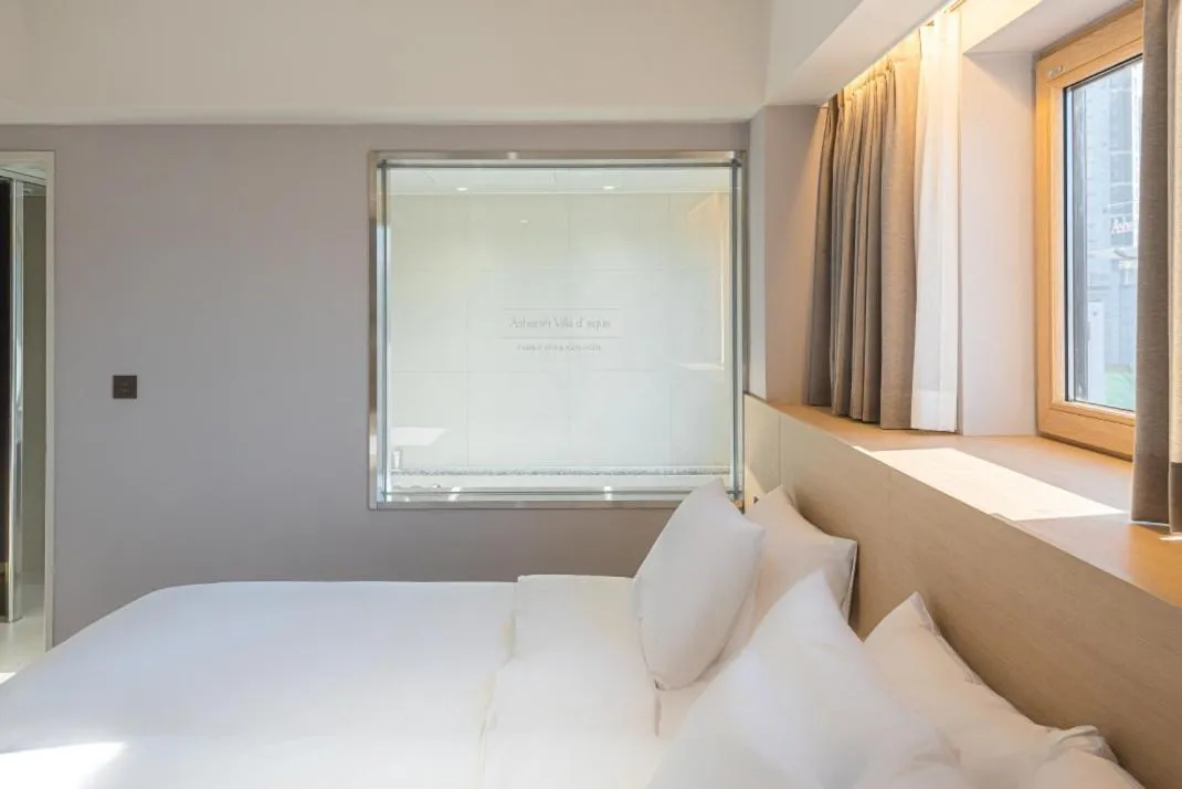 Bed in Asherah Villa d' aqua Hotel