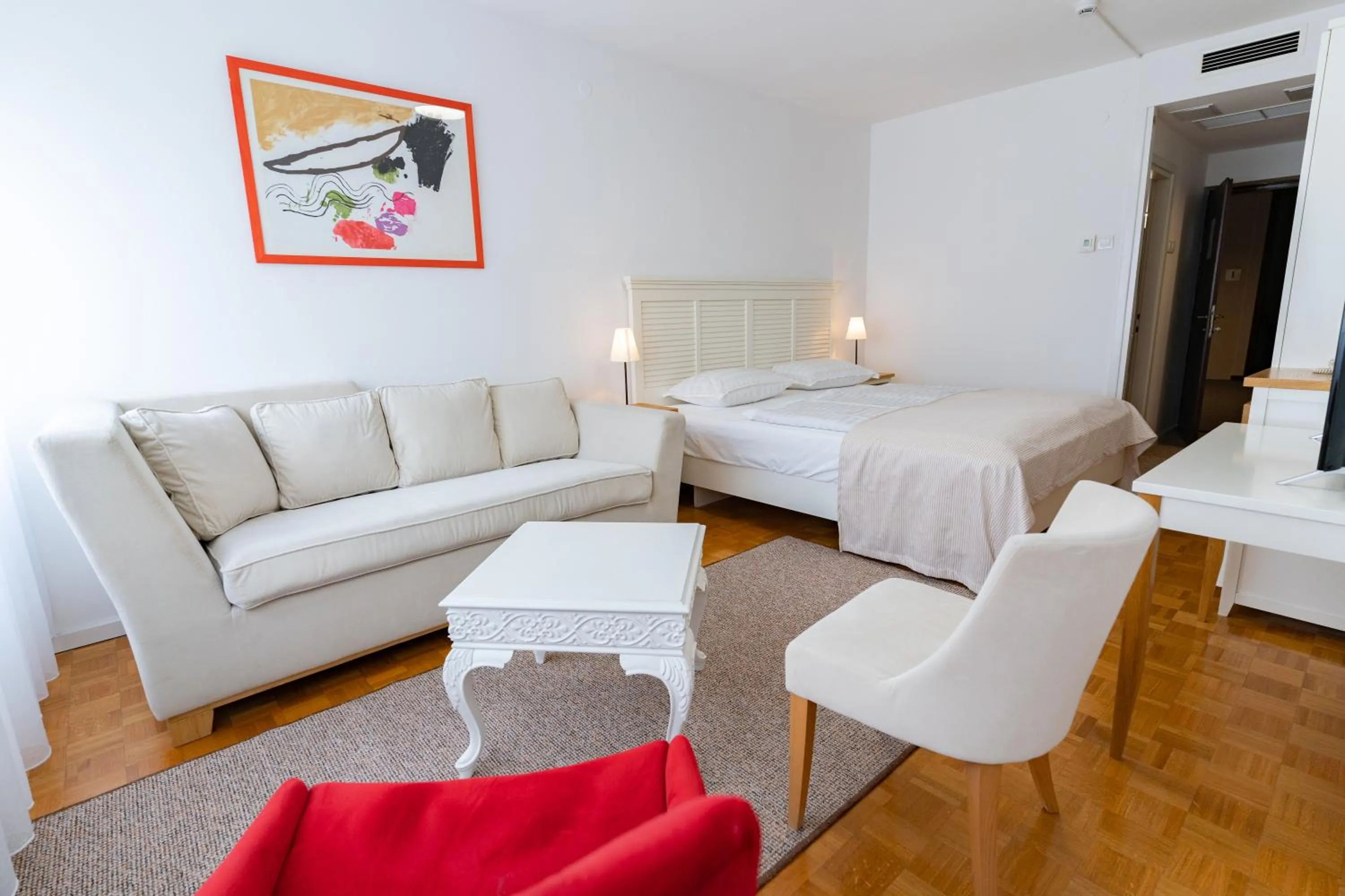 Seating area, Bed in Artearia Hotel