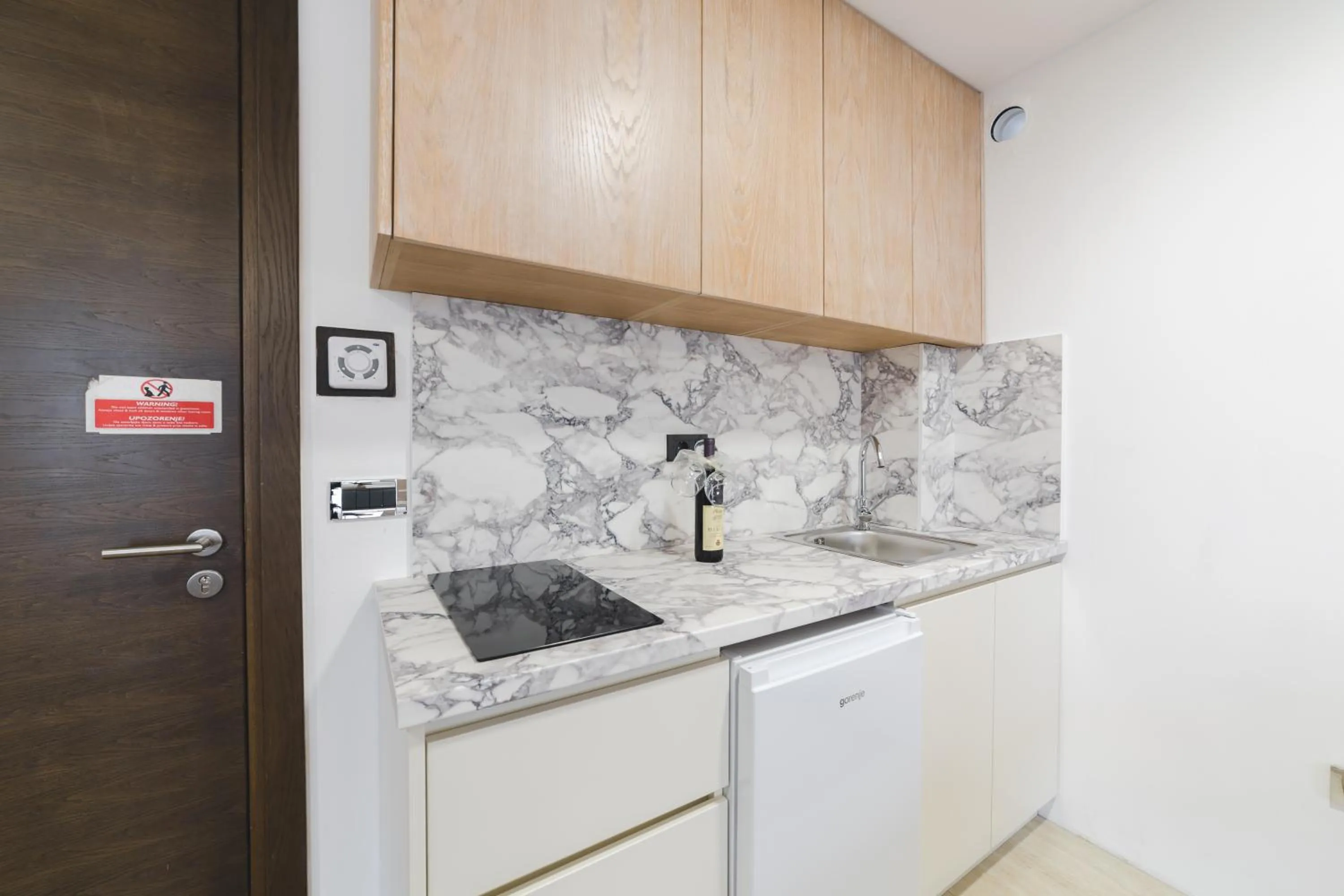 Kitchen or kitchenette in Hotel & Apartments HEC Residence