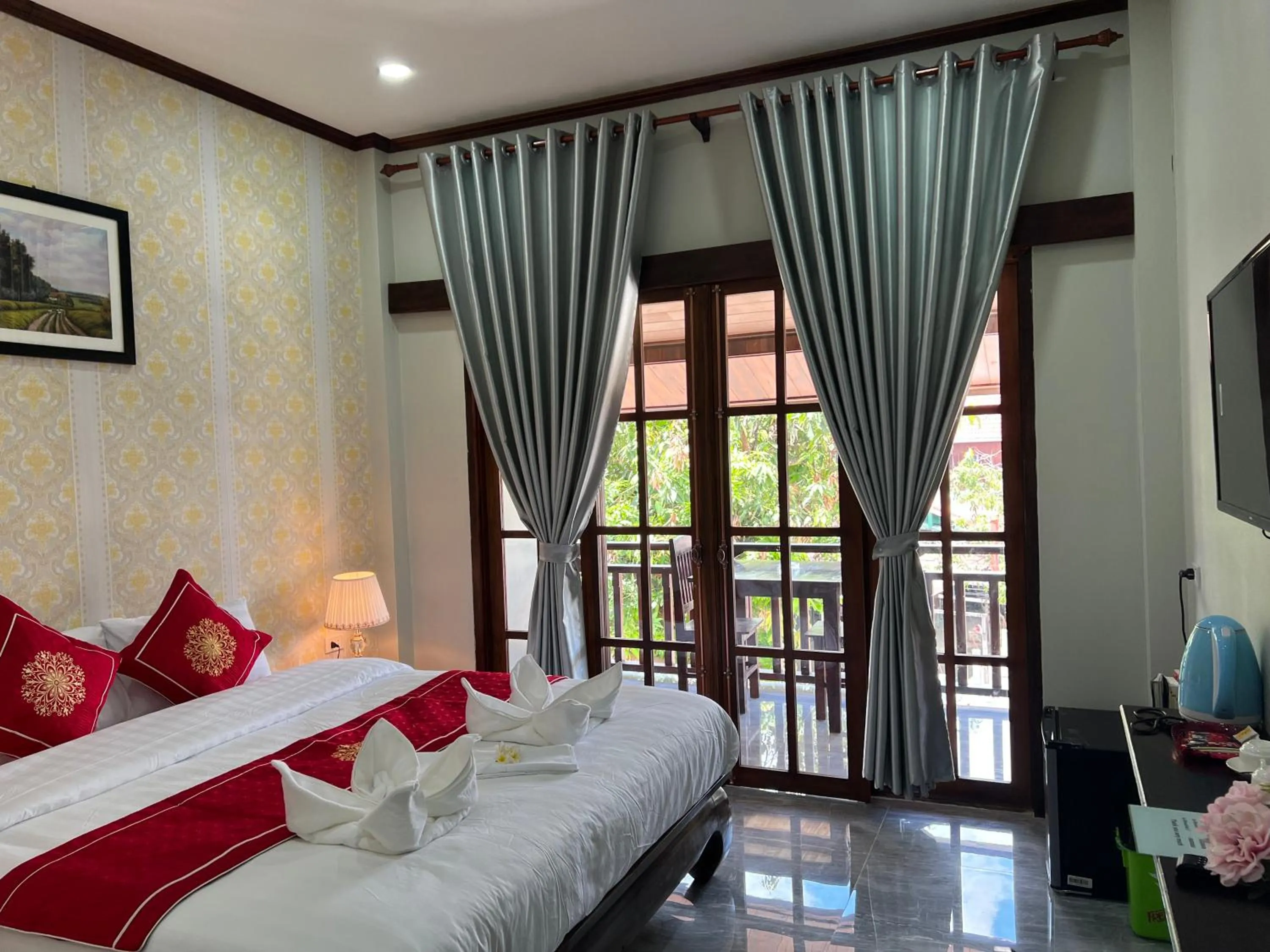 Bed in Le KhounSok Boutique Hotel