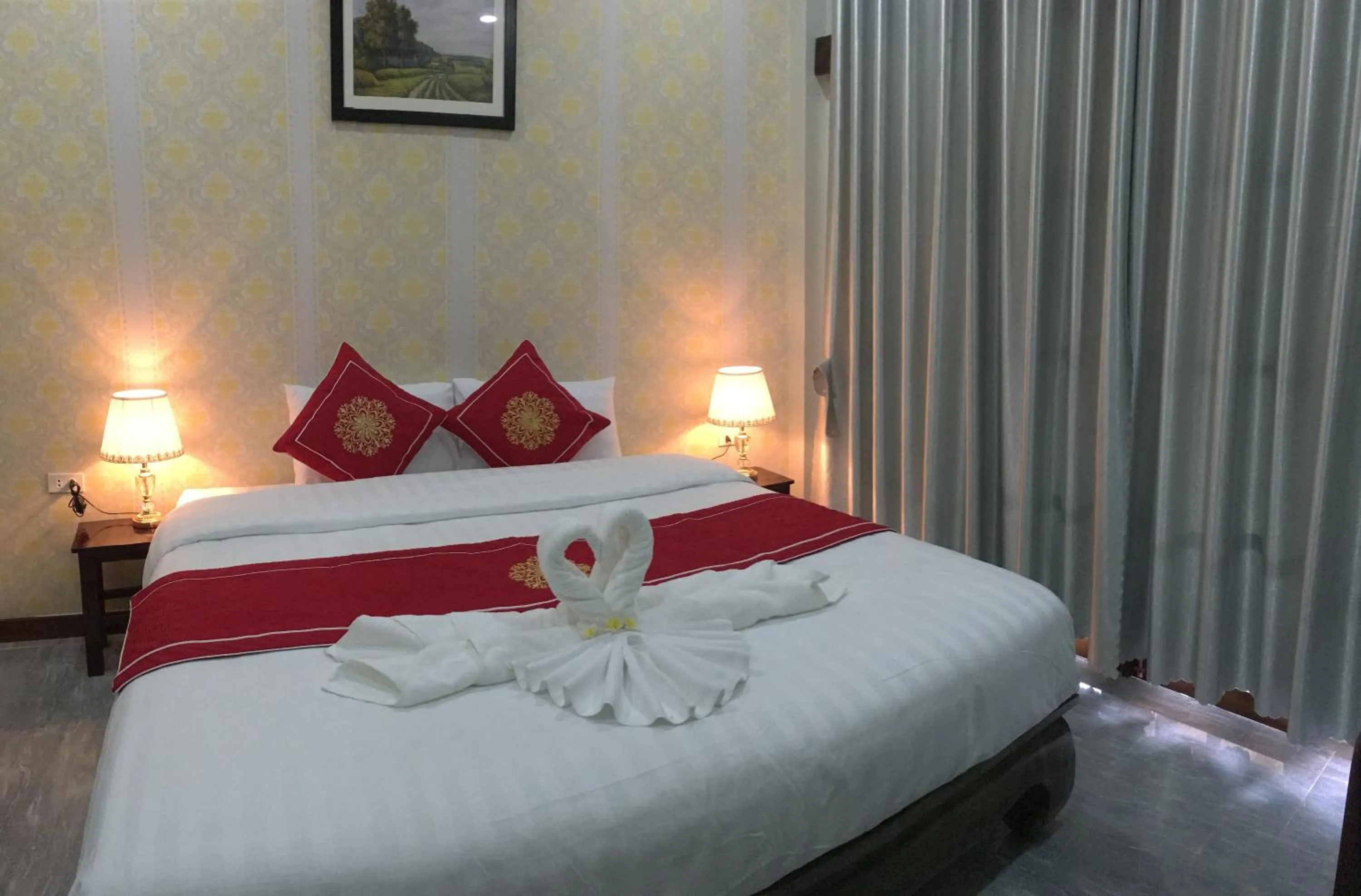 Bed in Le KhounSok Boutique Hotel