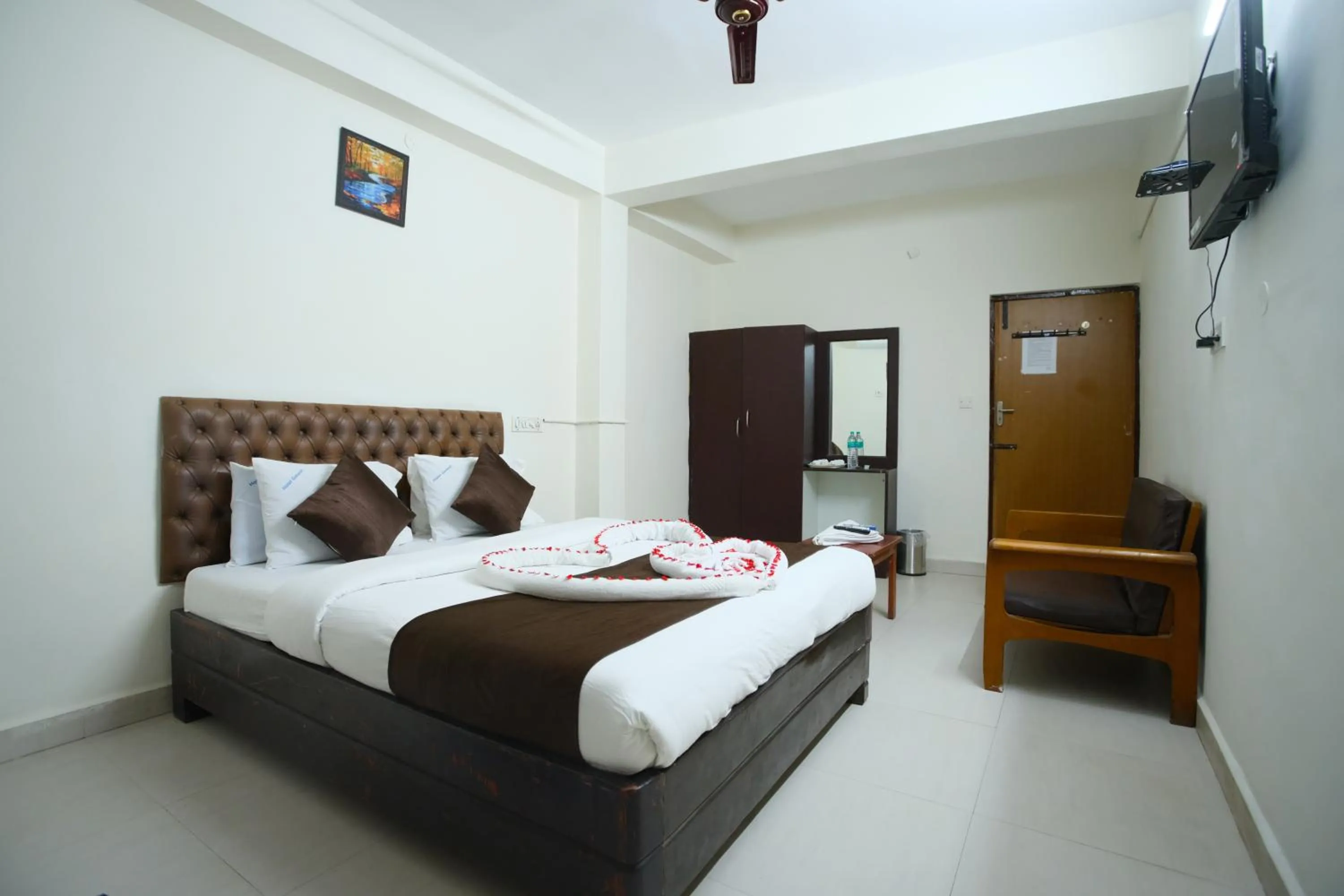 Bed in Ganesh Guest House