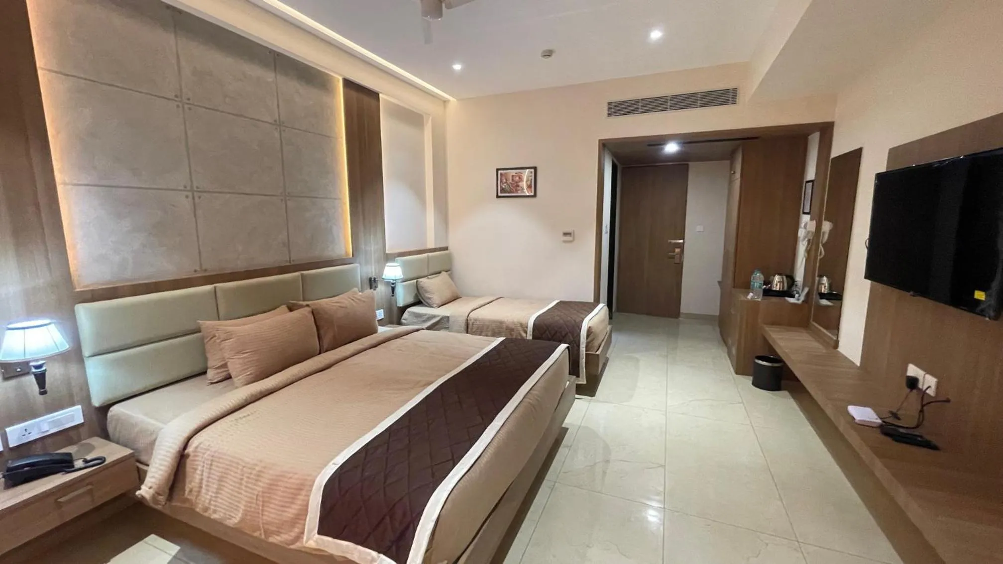 Bed in HOTEL VAHINI GRAND