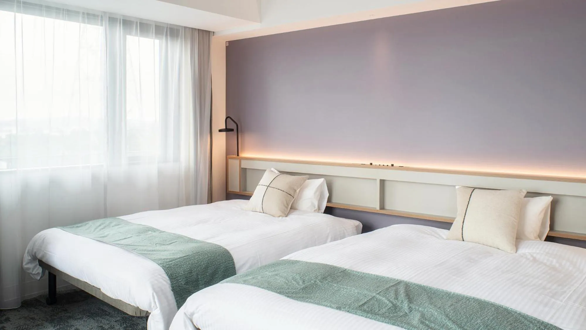 Bed in REF Okinawa Arena by VESSEL HOTELS