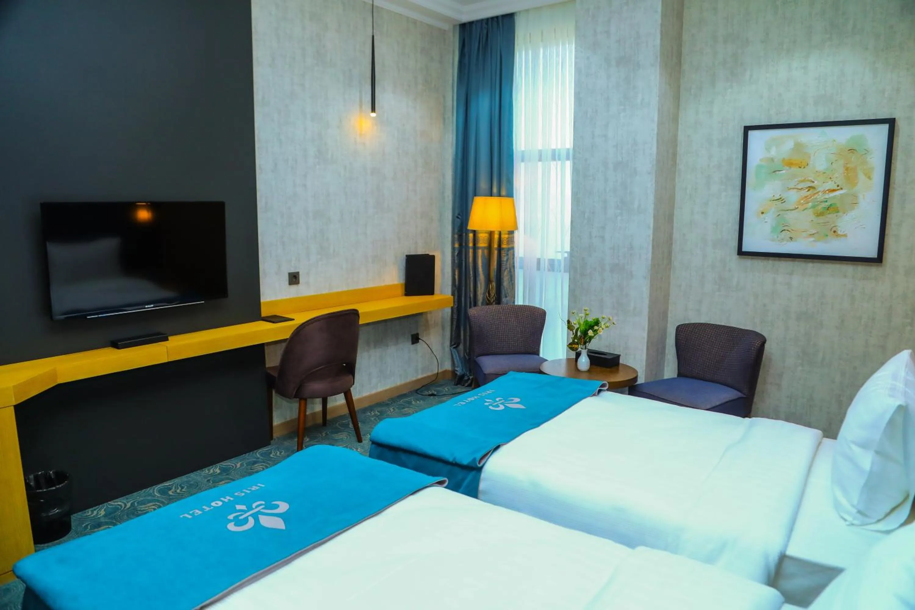 Communal lounge/ TV room, Bed in Iris Hotel Baku