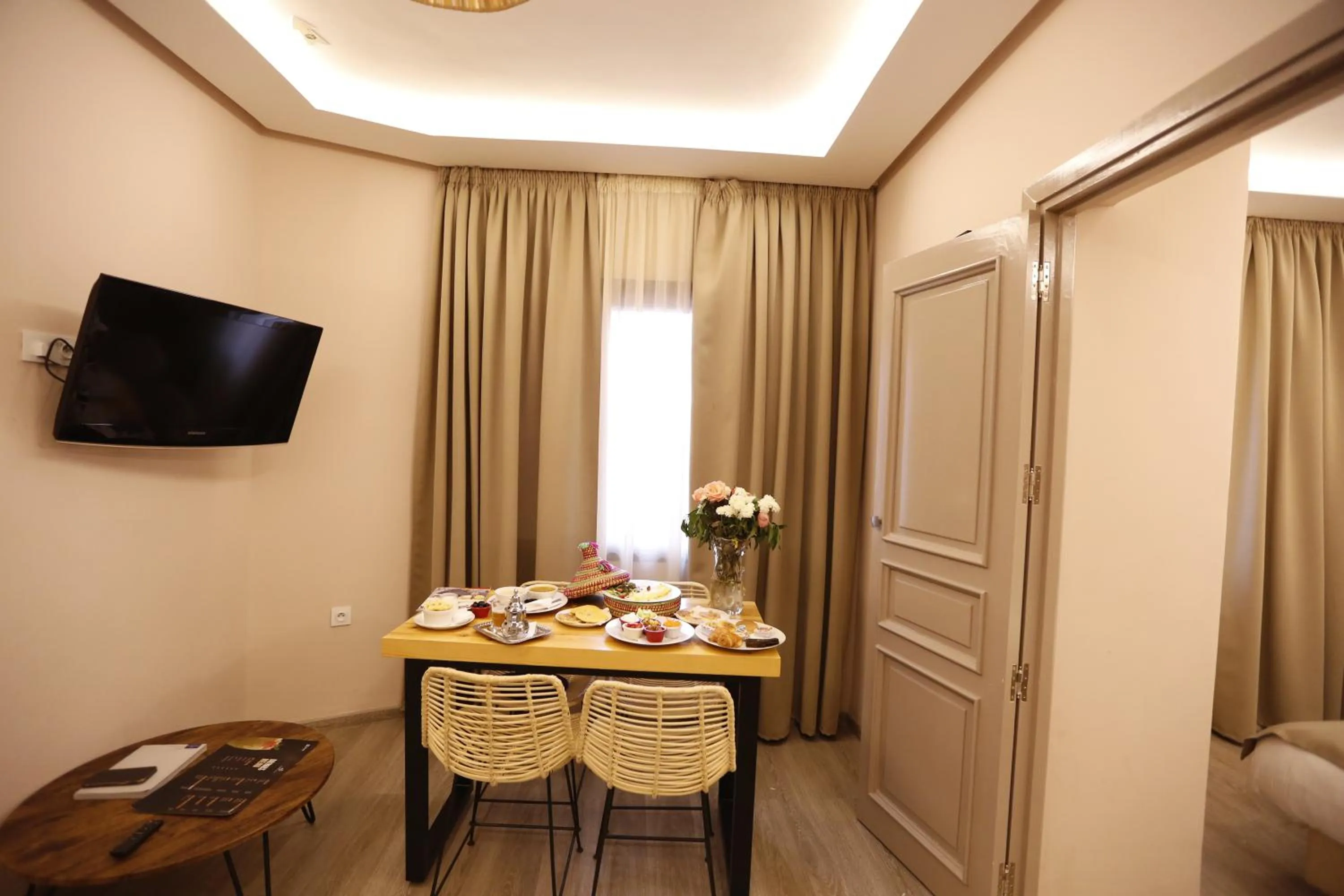 Communal lounge/ TV room in Amani Hotel Suites & Spa