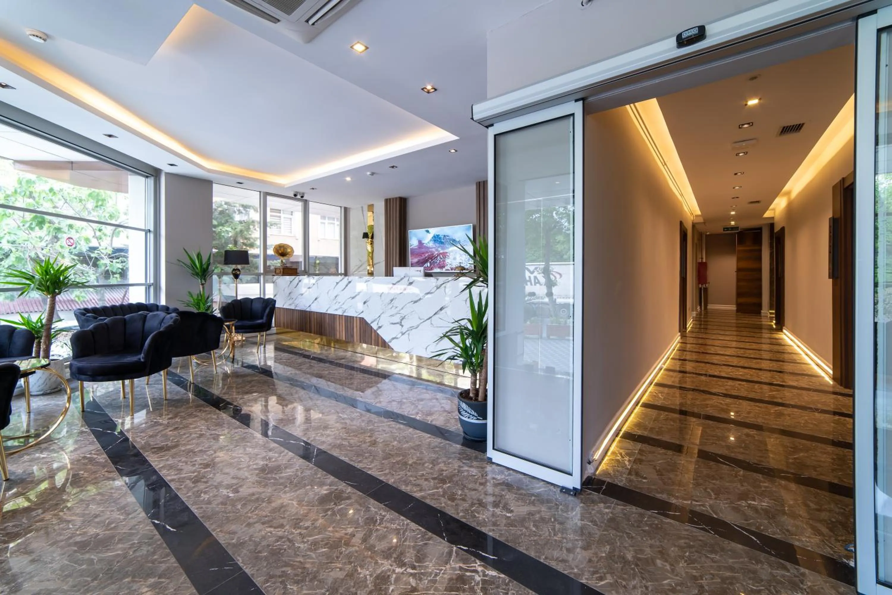 Lobby or reception in Garden Room Suit Hotel