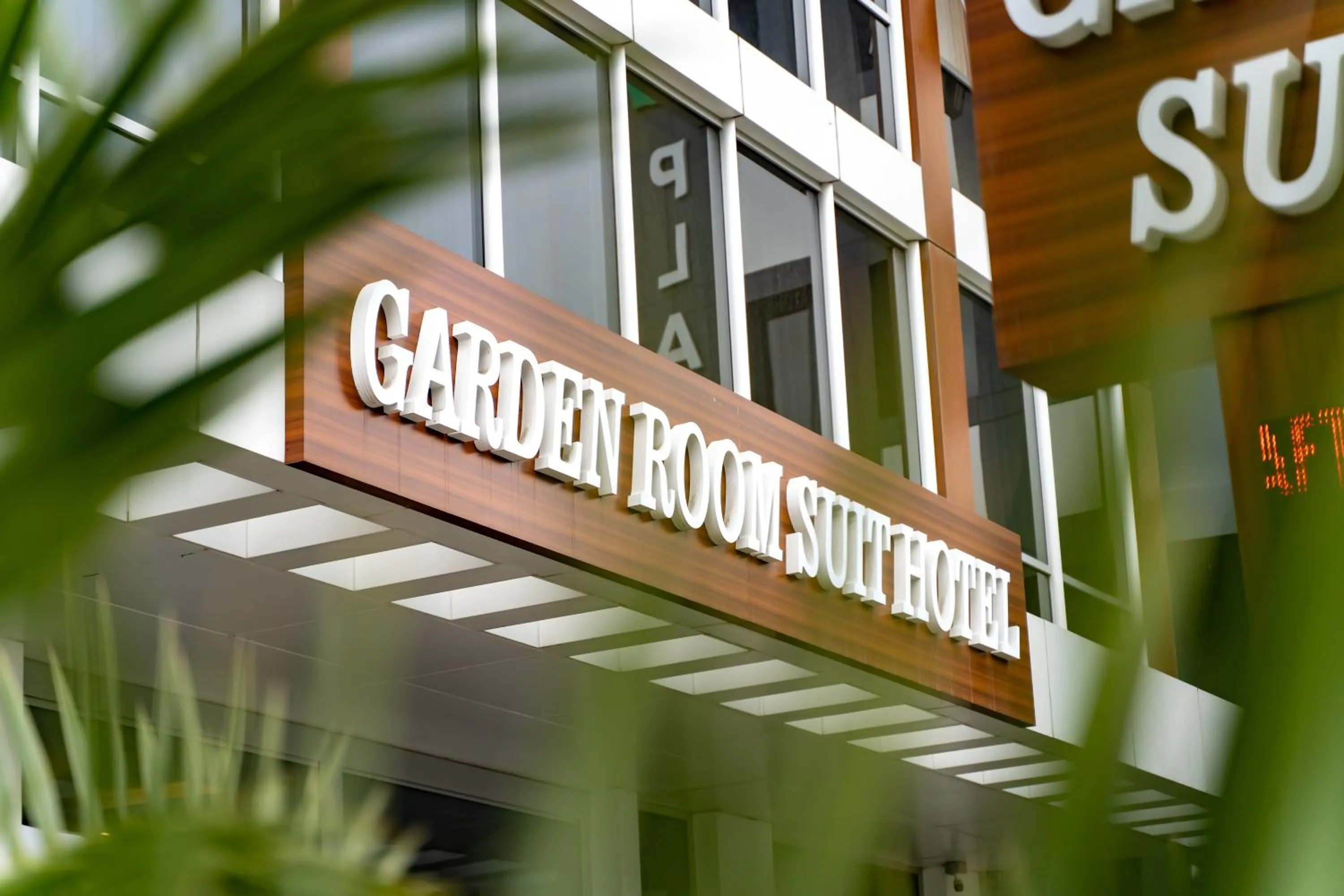 Property logo or sign in Garden Room Suit Hotel