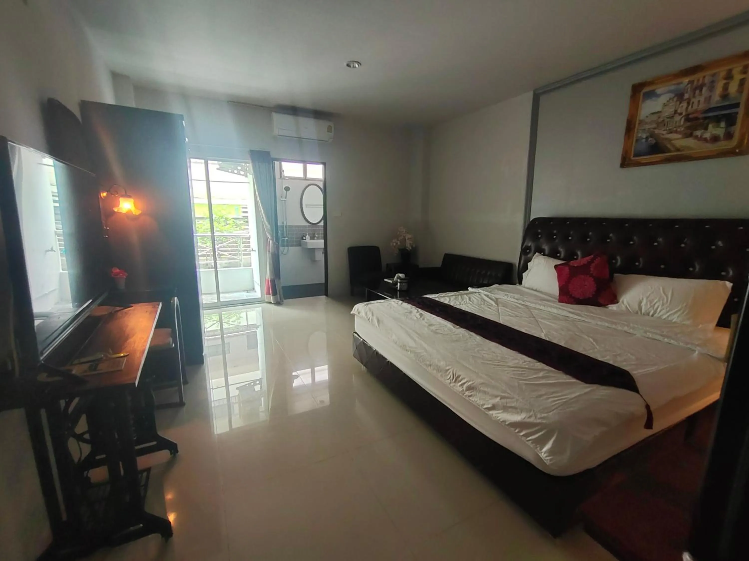 Bed in ห้องพักนครราชสีมา The Rich Room