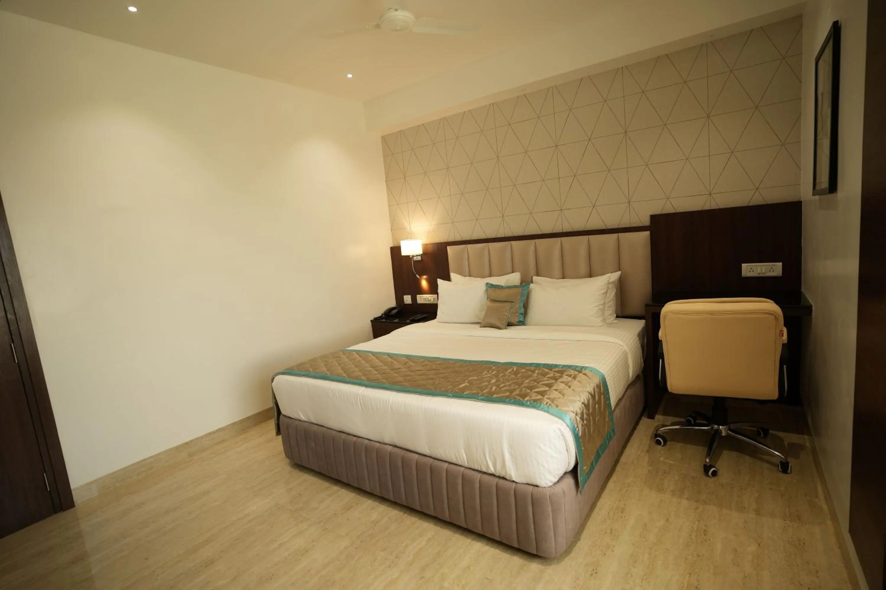 Photo of the whole room, Bed in Sri Ambal Grand