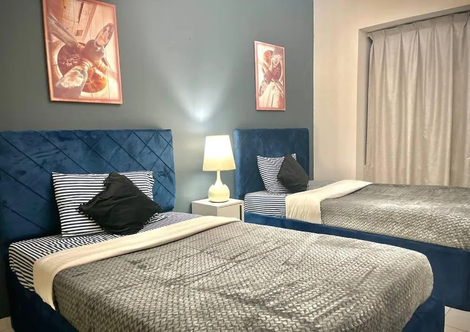 Bed in Chic 3 bedroom apartment