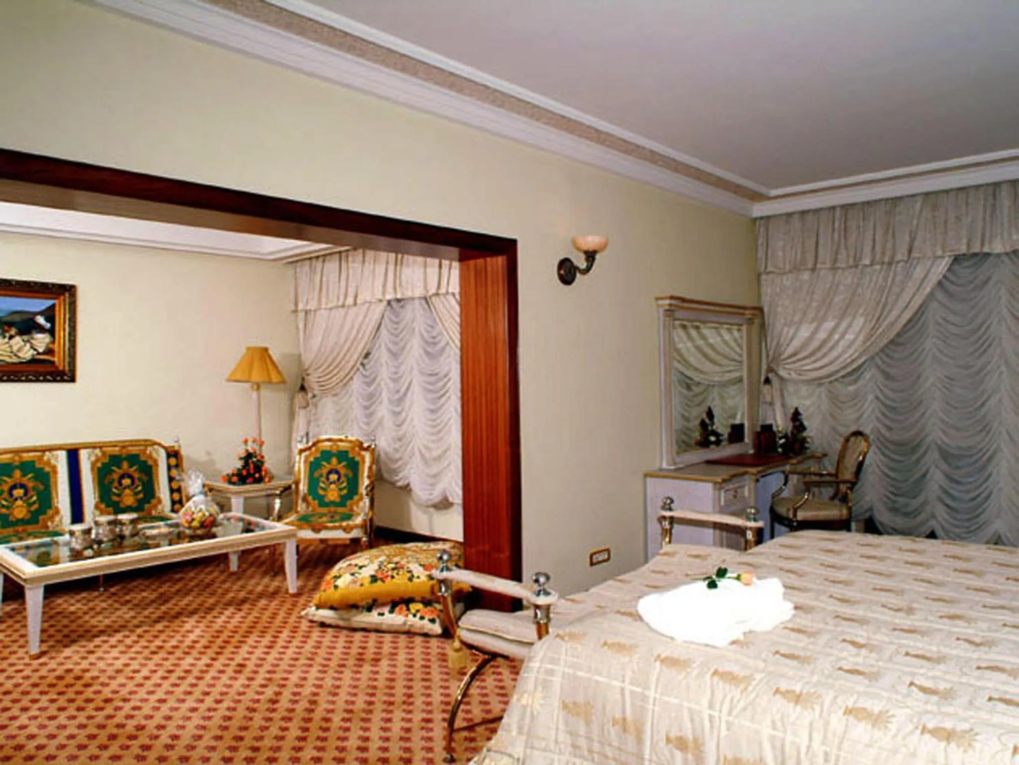 Seating area, Bed in Ramada By Wyndham Fes