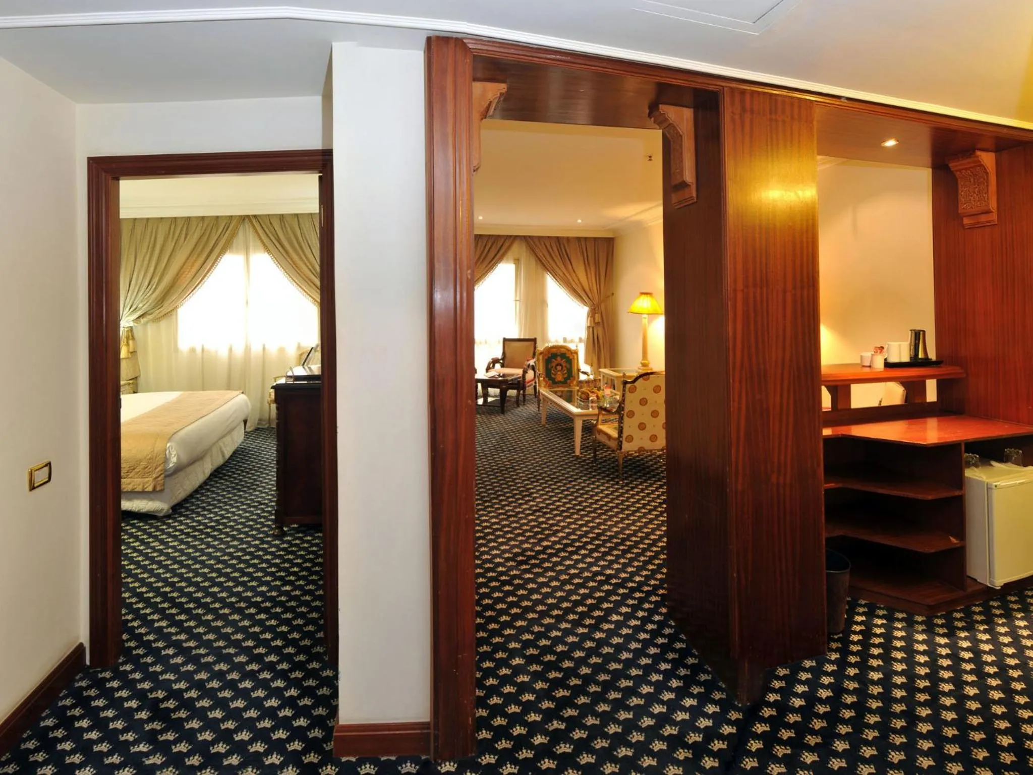 Seating area, Bed in Ramada By Wyndham Fes