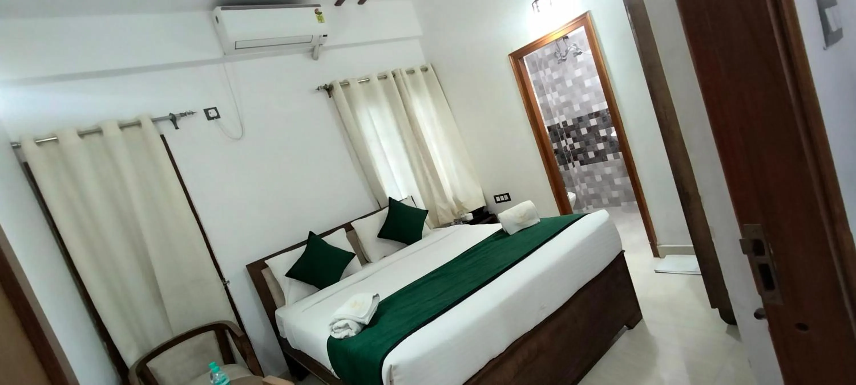 Bed in Hotel Aman Residency